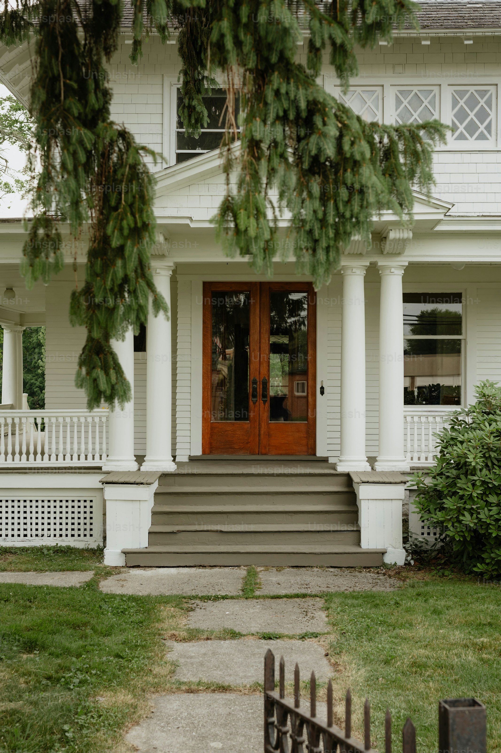 A large white house with a red door