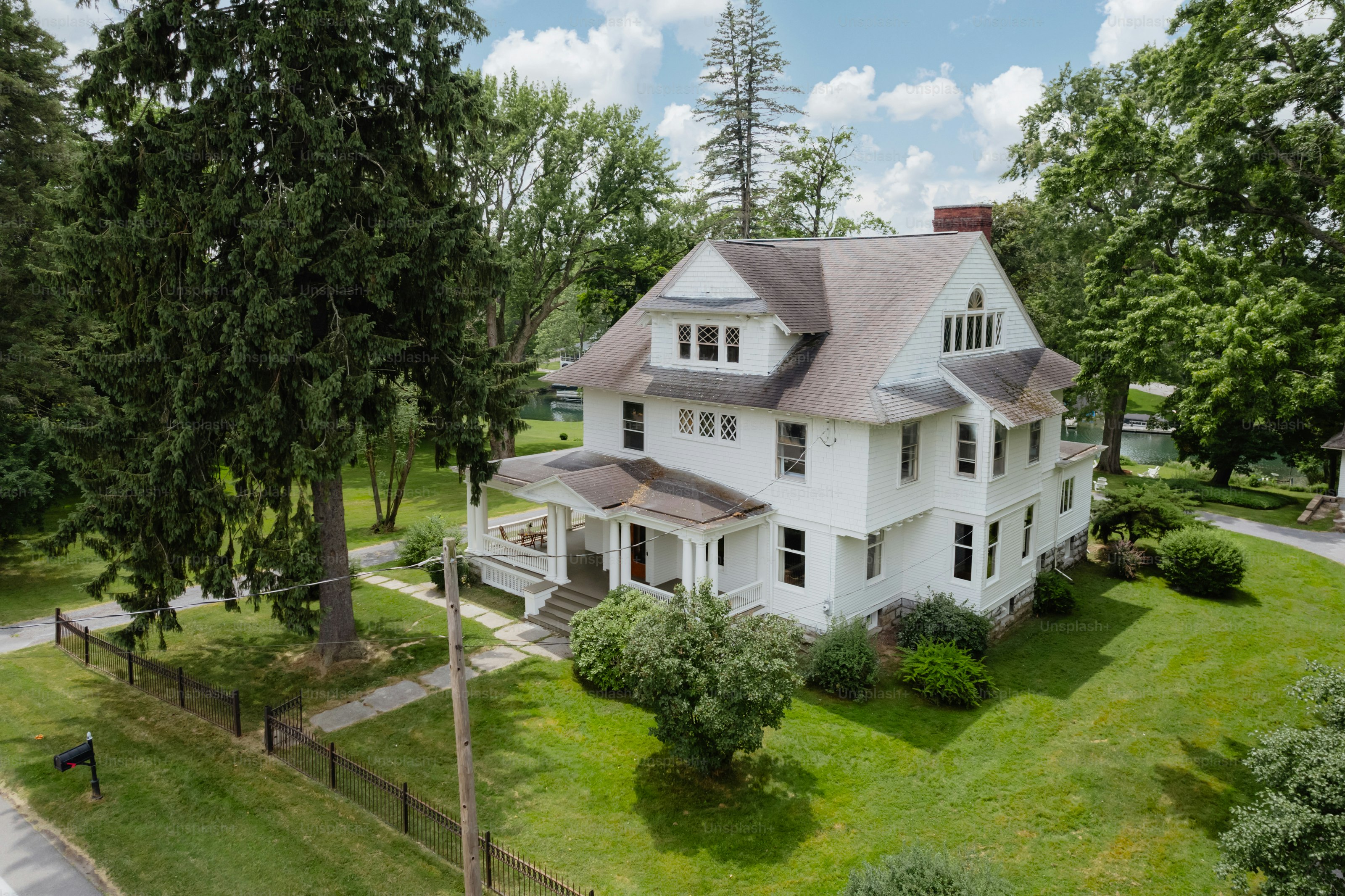 An aerial view of a large white house