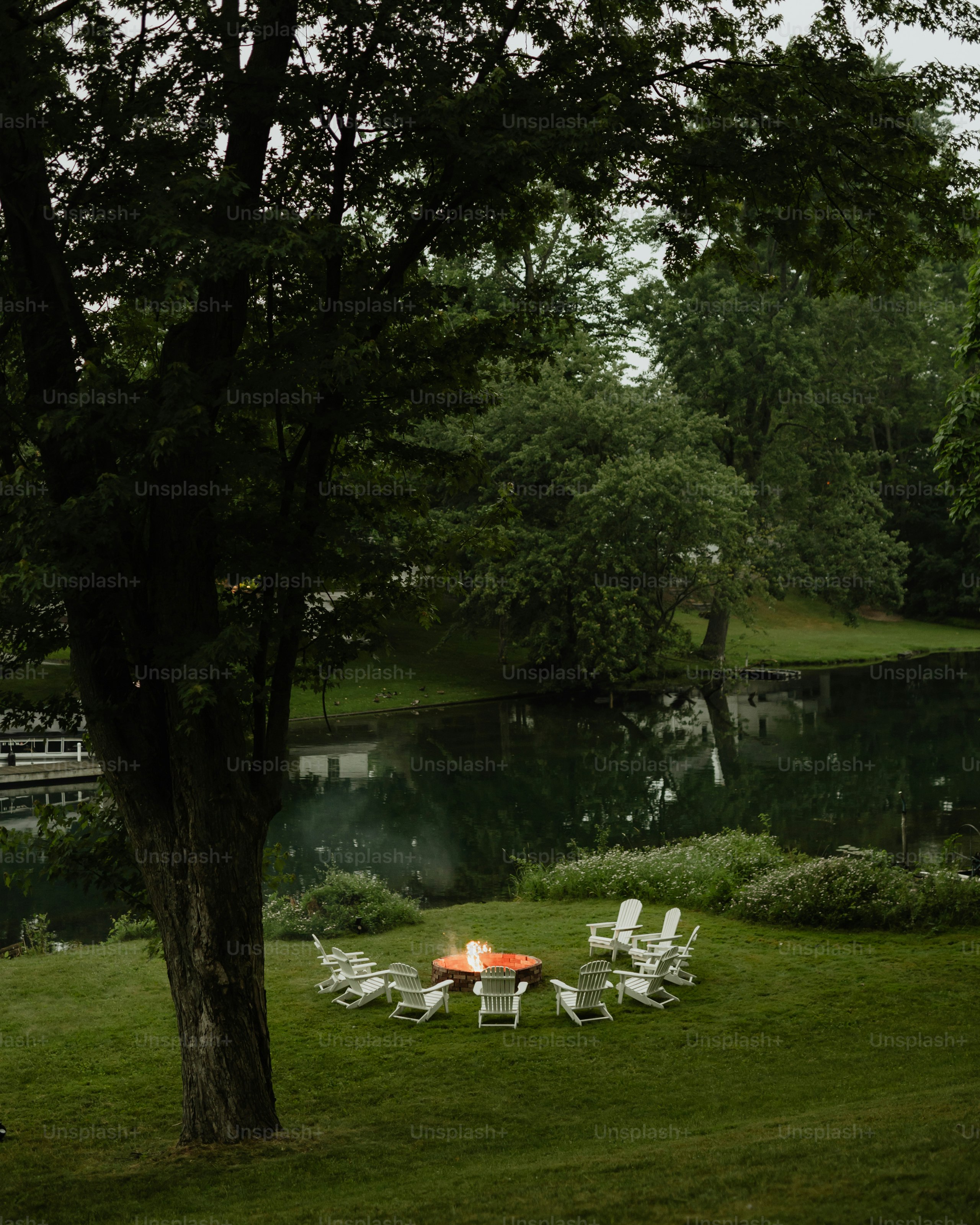 A fire pit in the middle of a grassy field
