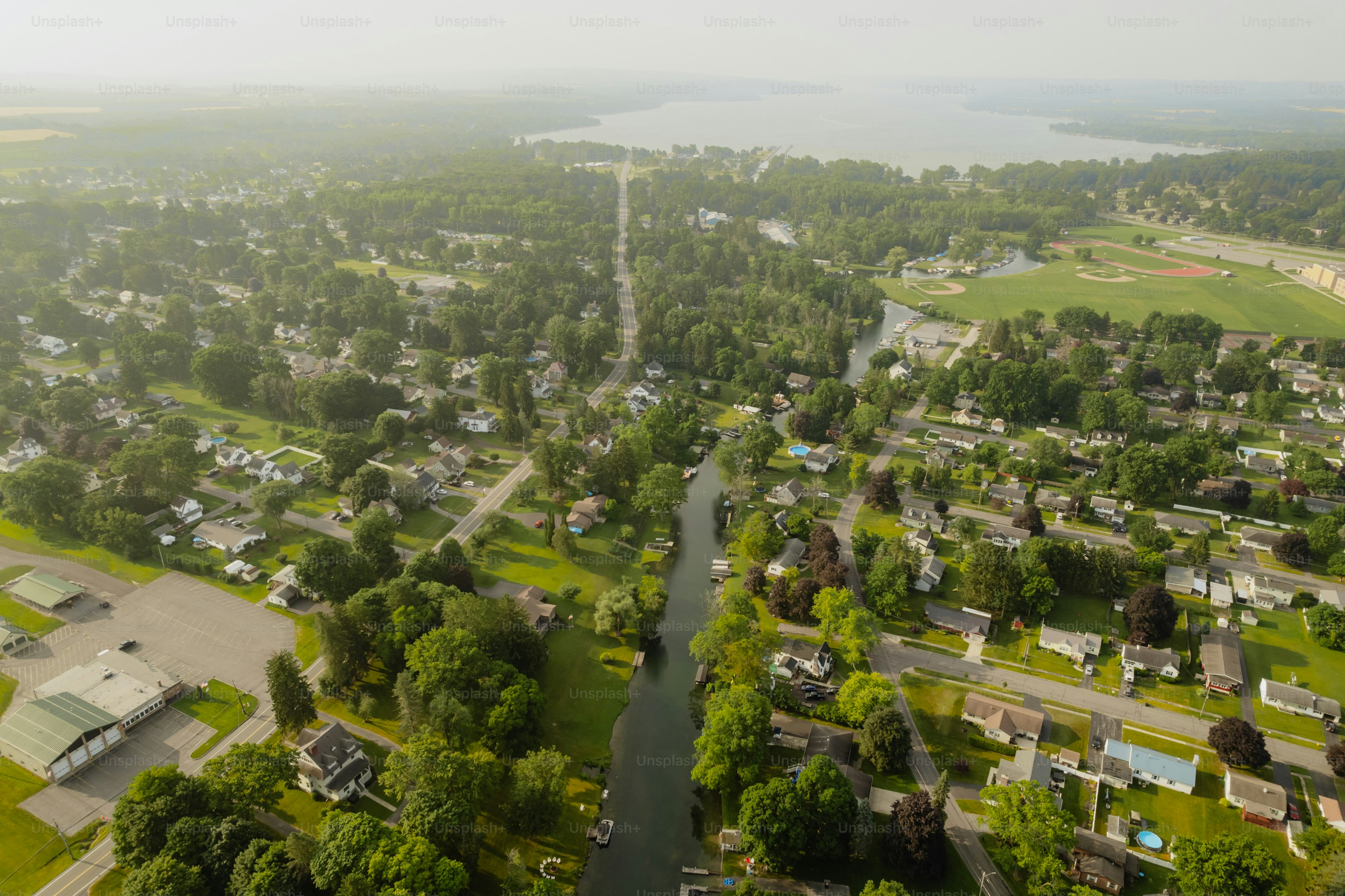 A bird's eye view of a river running through a small town