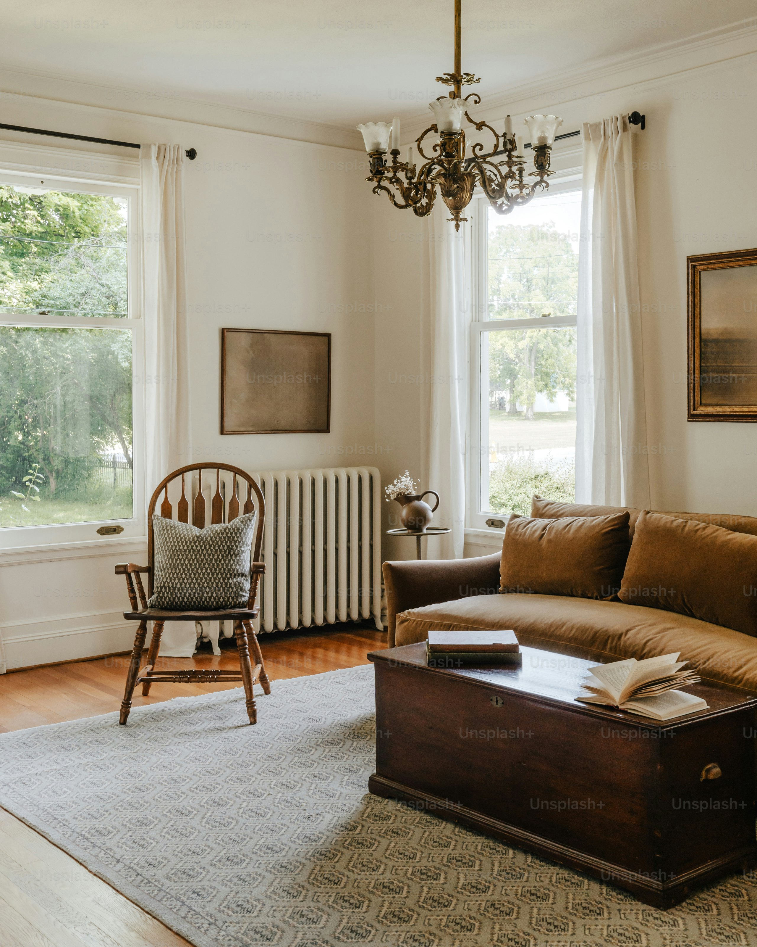 A living room filled with furniture and a chandelier