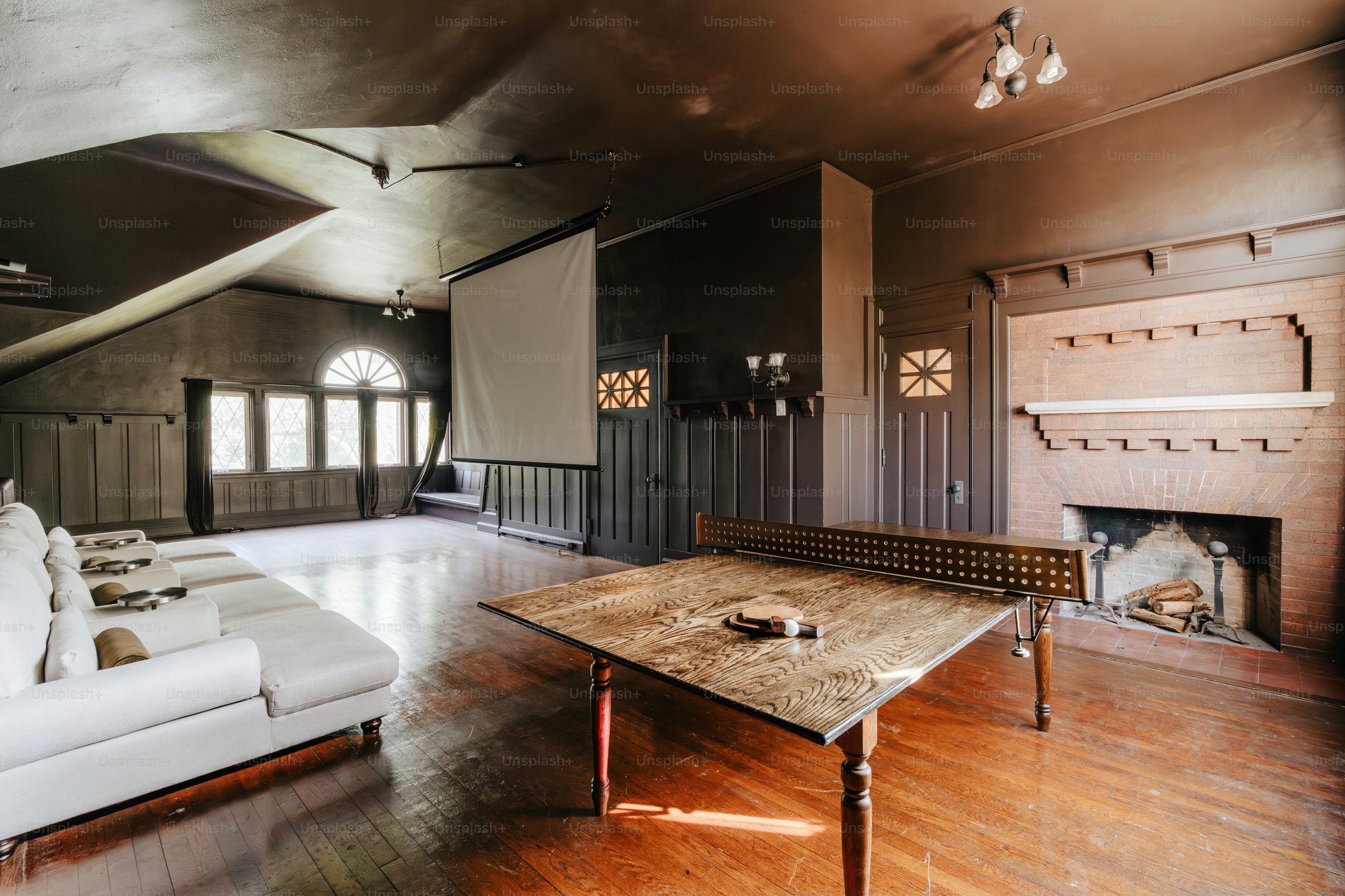 A living room filled with furniture and a fire place