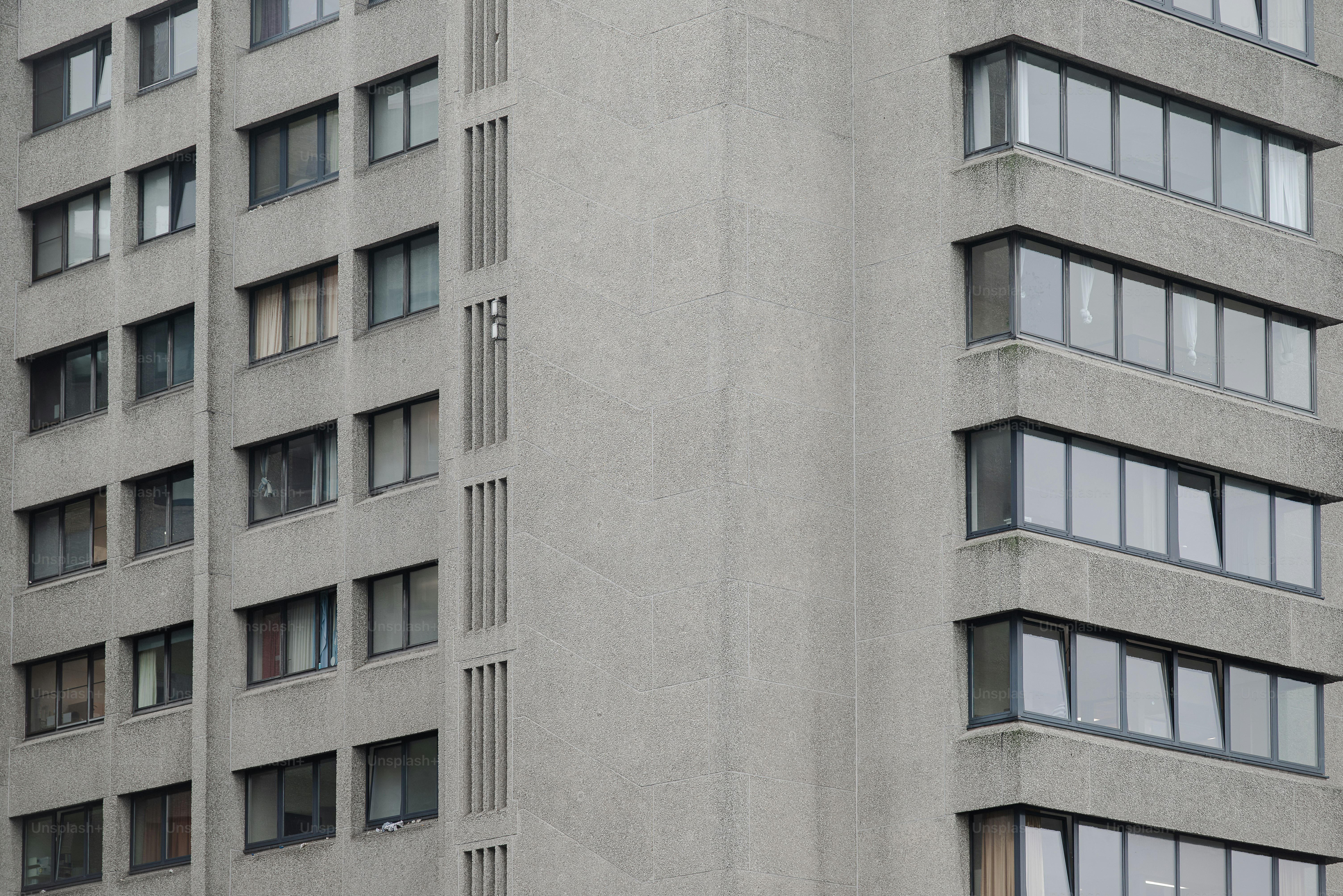 A very tall building with a clock on it's side photo – Architecture ...