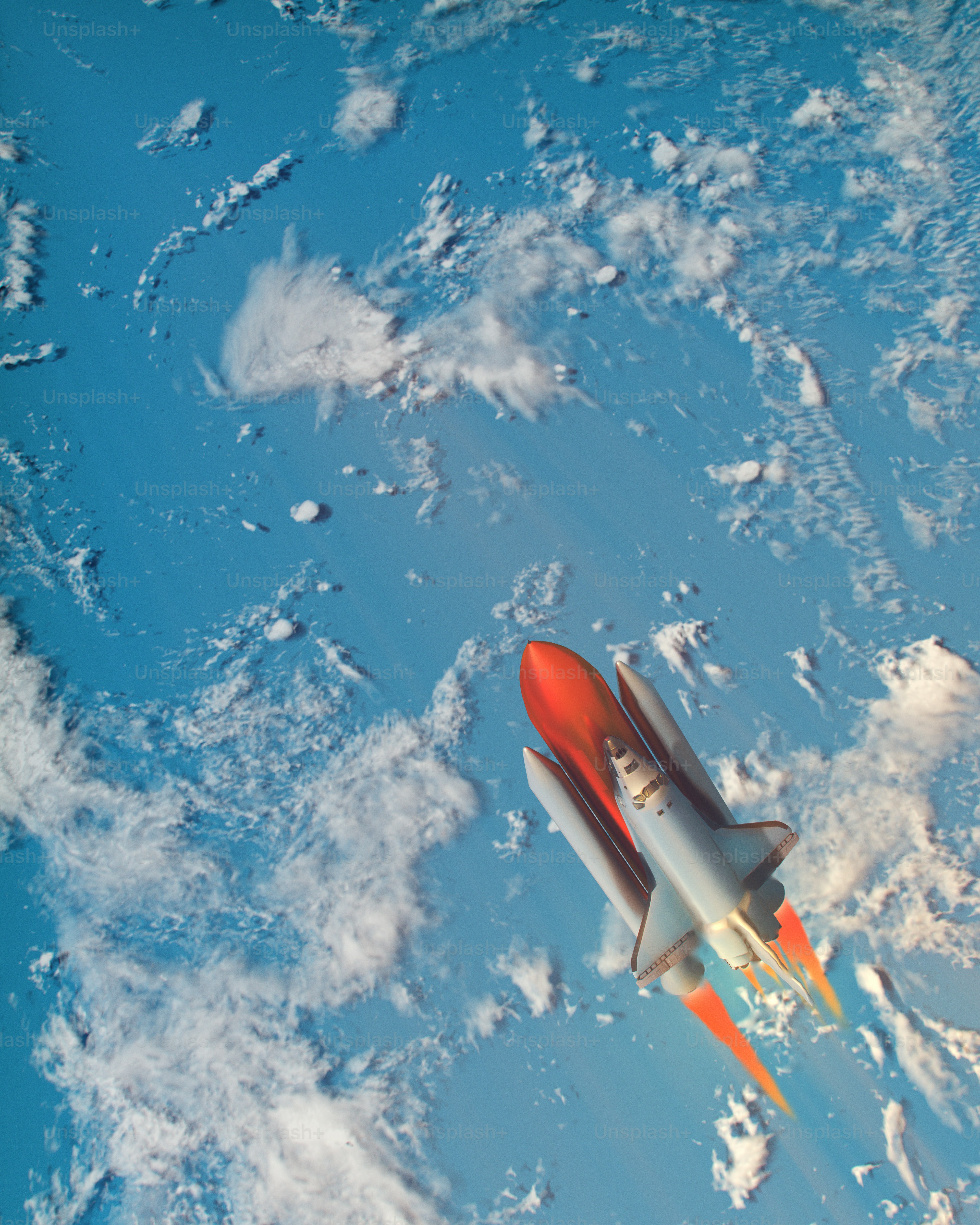 Un avión rojo y blanco volando por el cielo