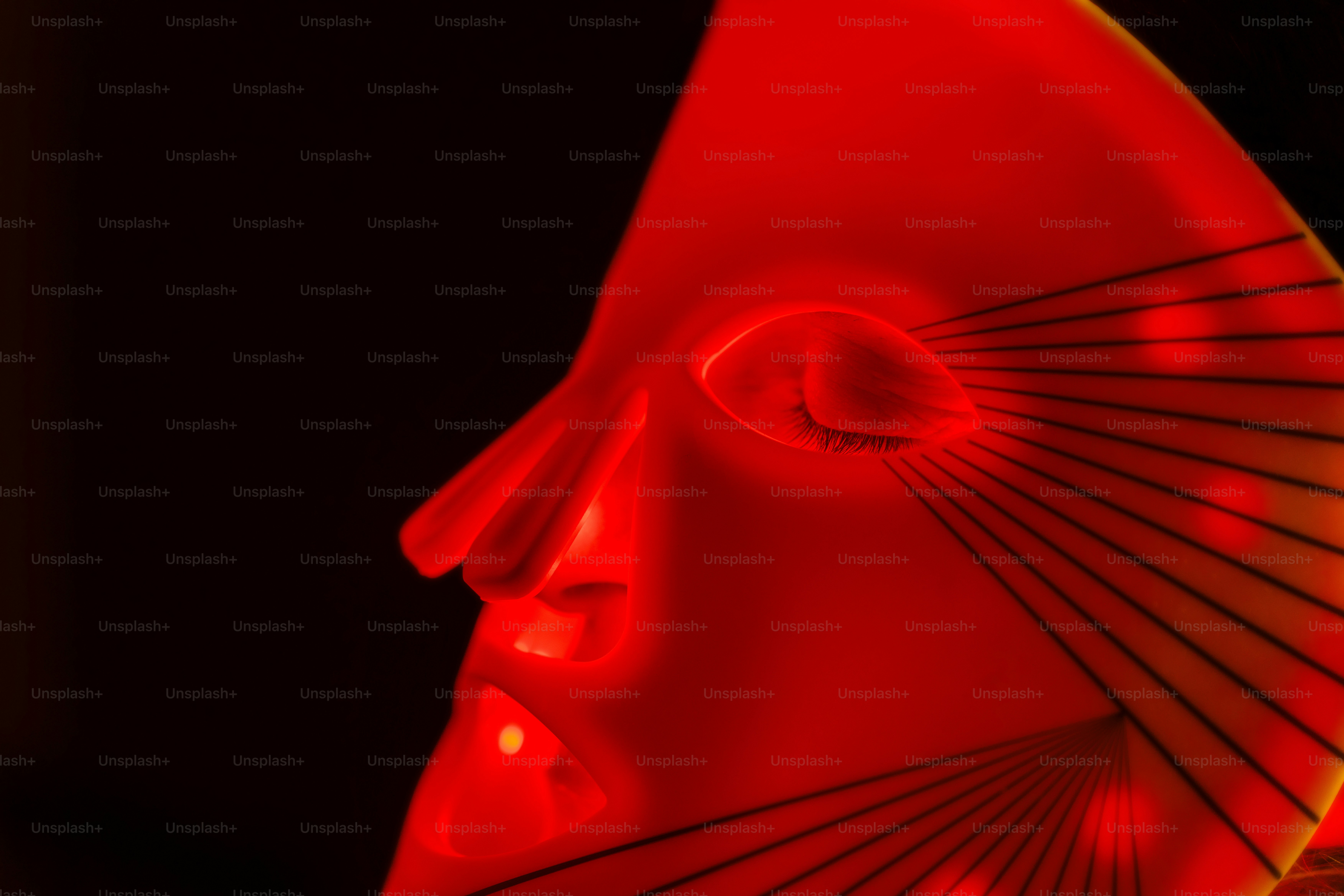 A close up of a red object with a black background