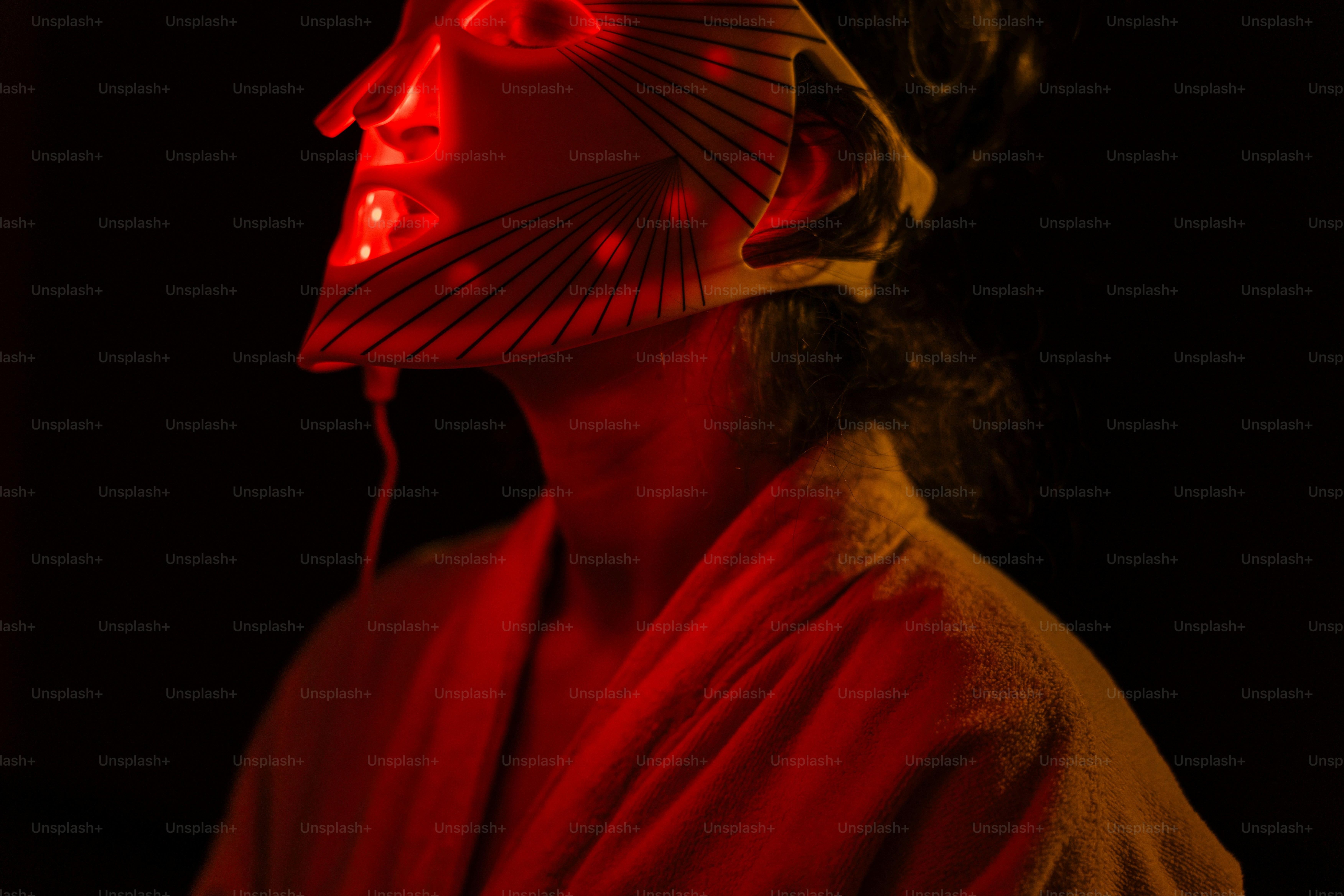 A man with a red light on his face