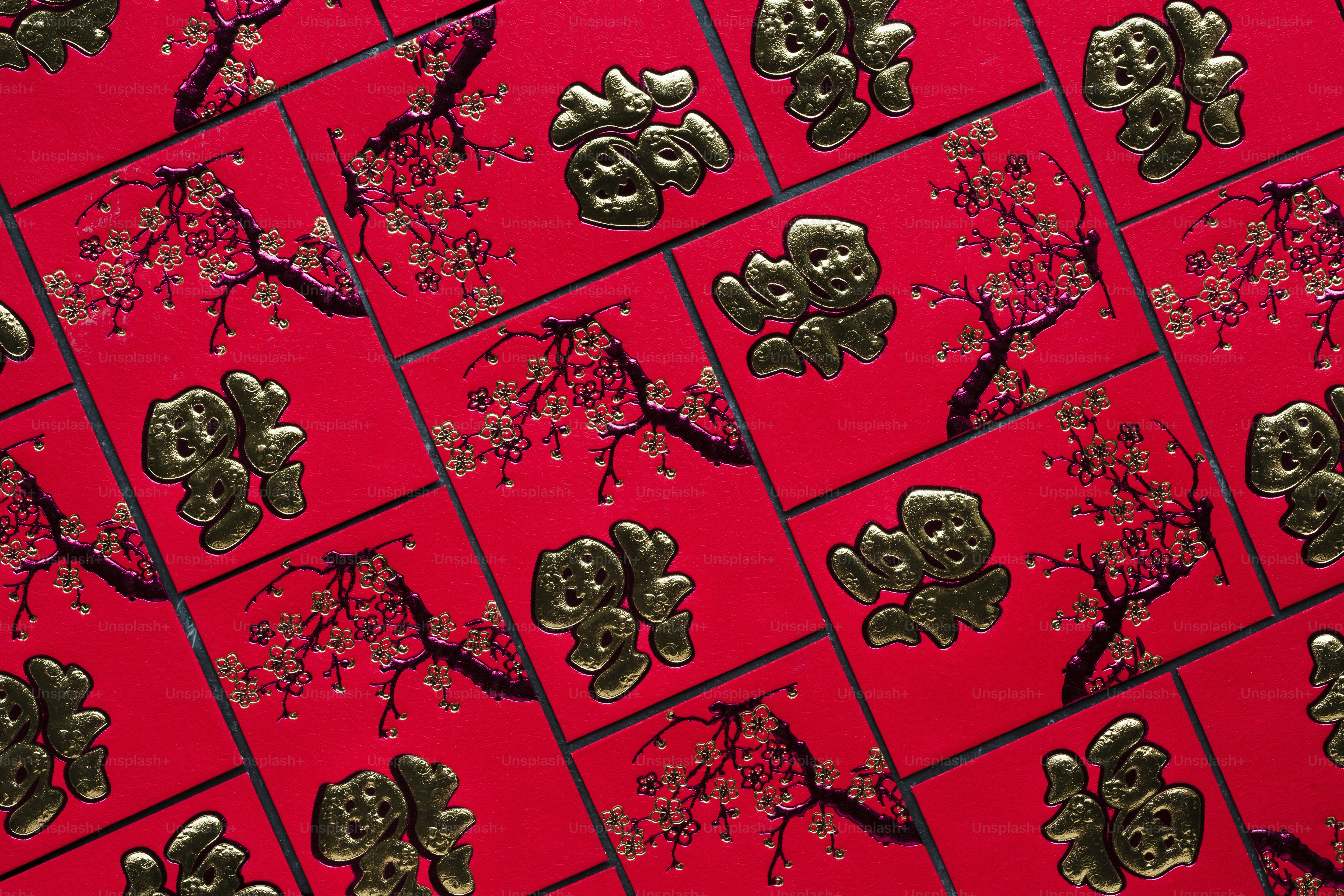 A bunch of skulls on a red background