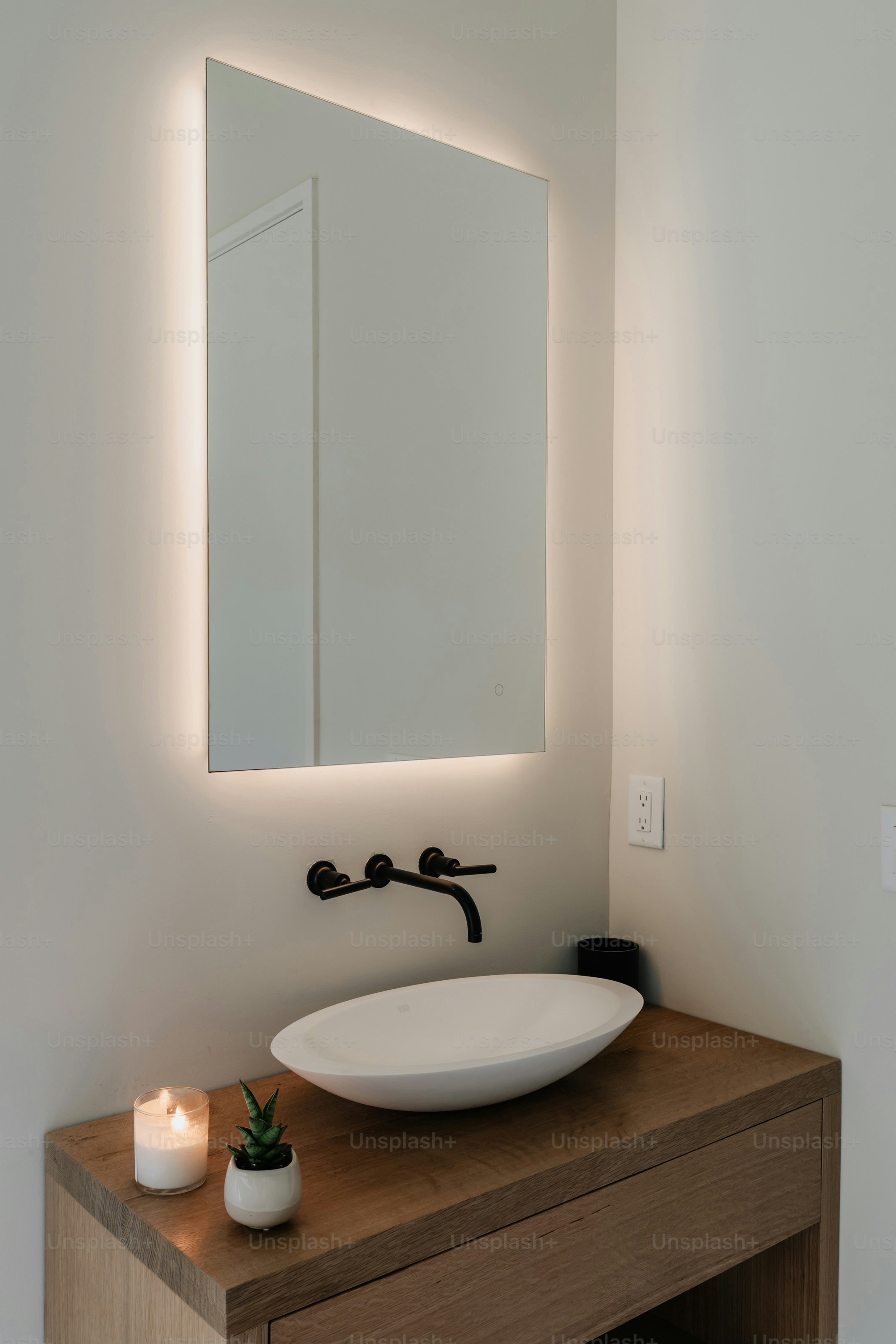 Bathroom lighting and mirror design above a vanity