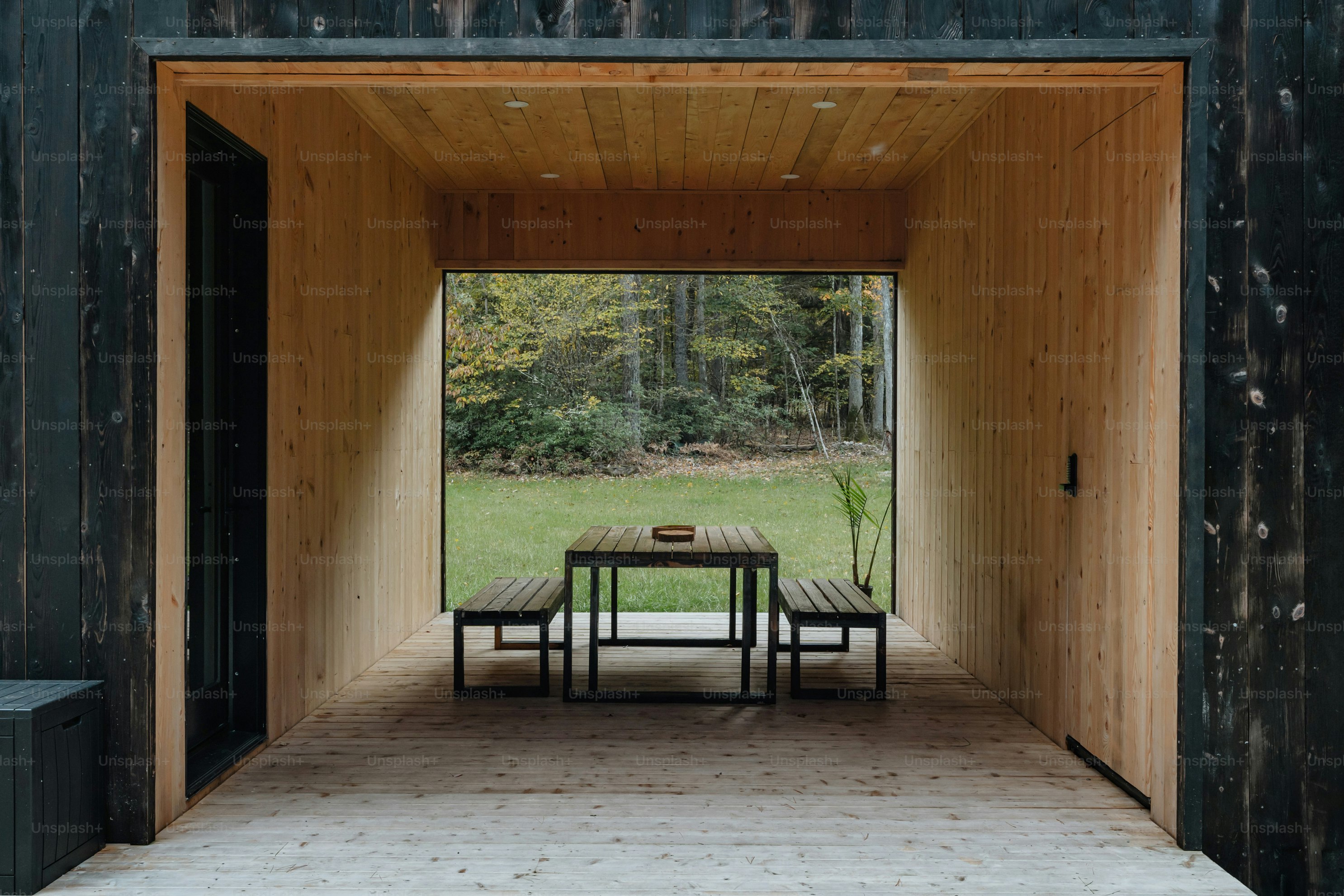 A room with a table and chairs inside of it