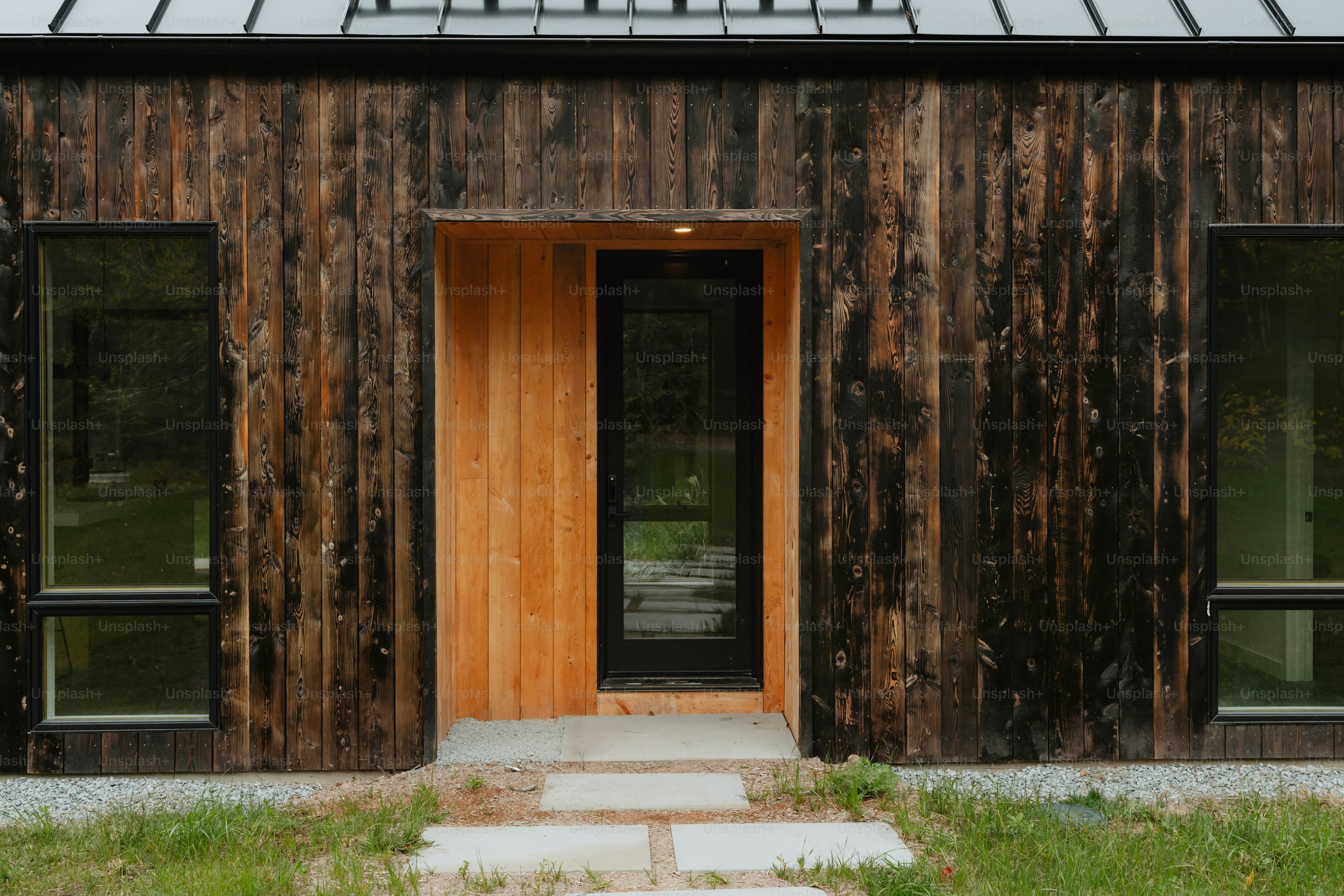 A small wooden house with a glass roof