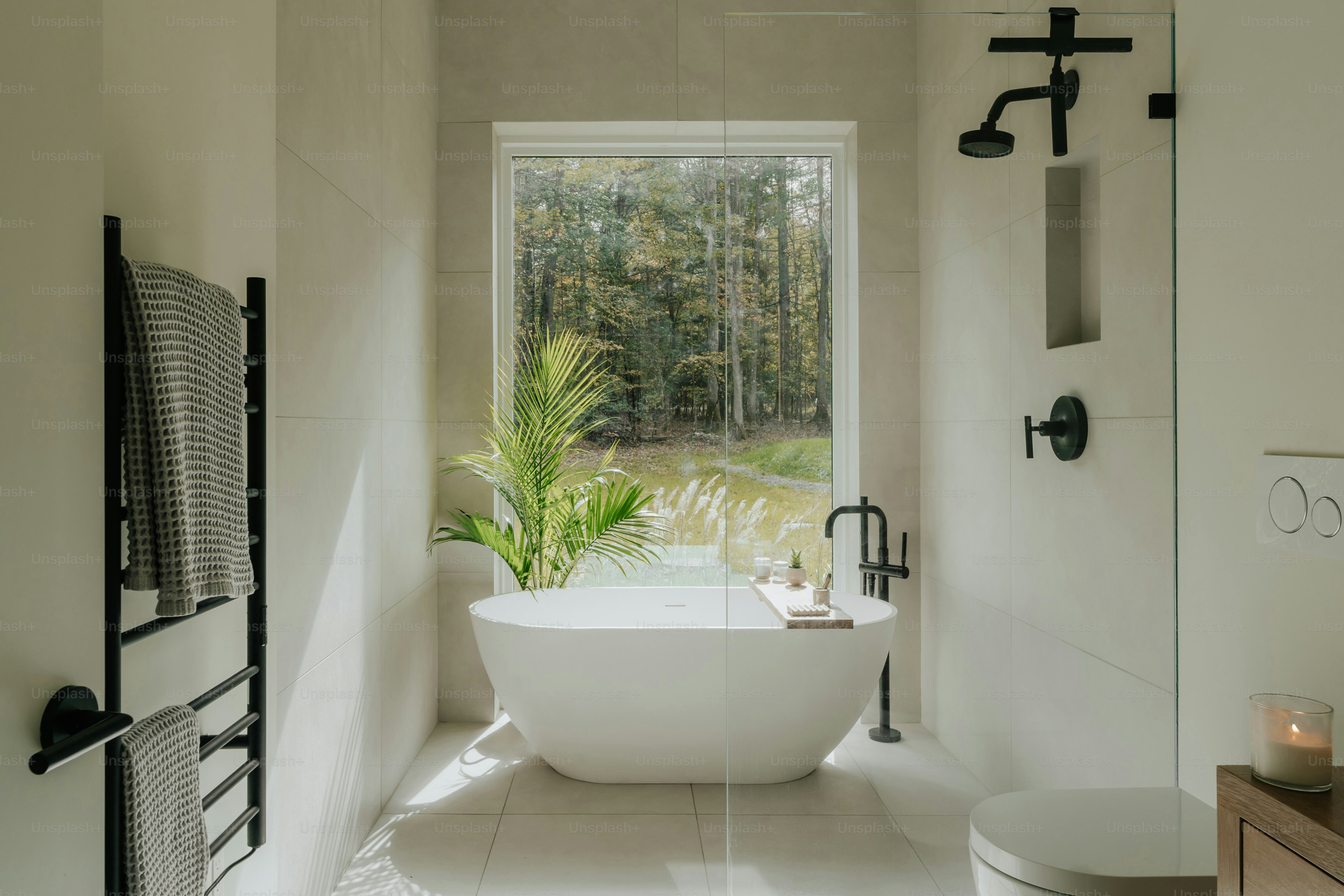 A bathroom with a tub and a toilet