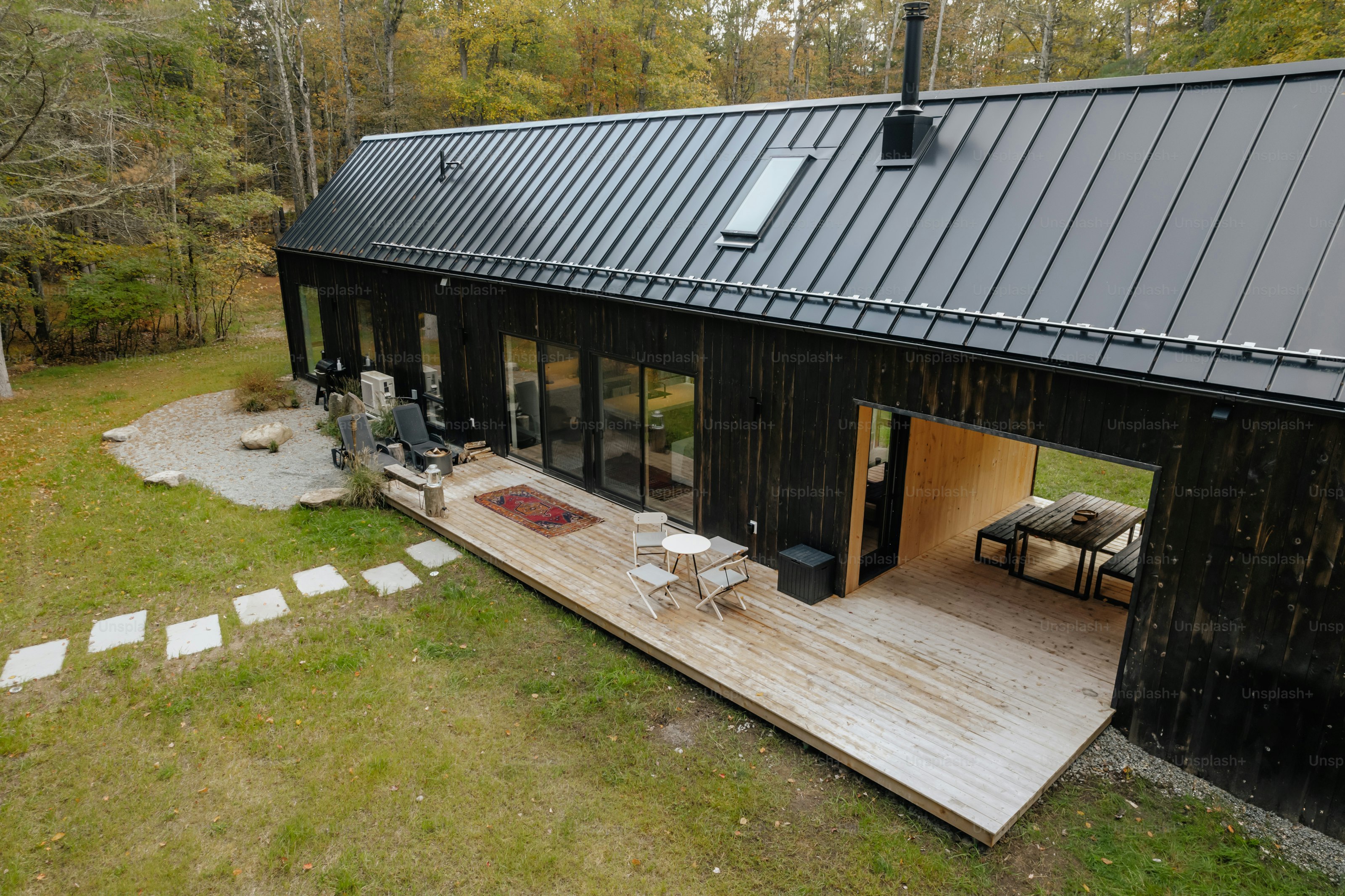 A house with a metal roof in the woods