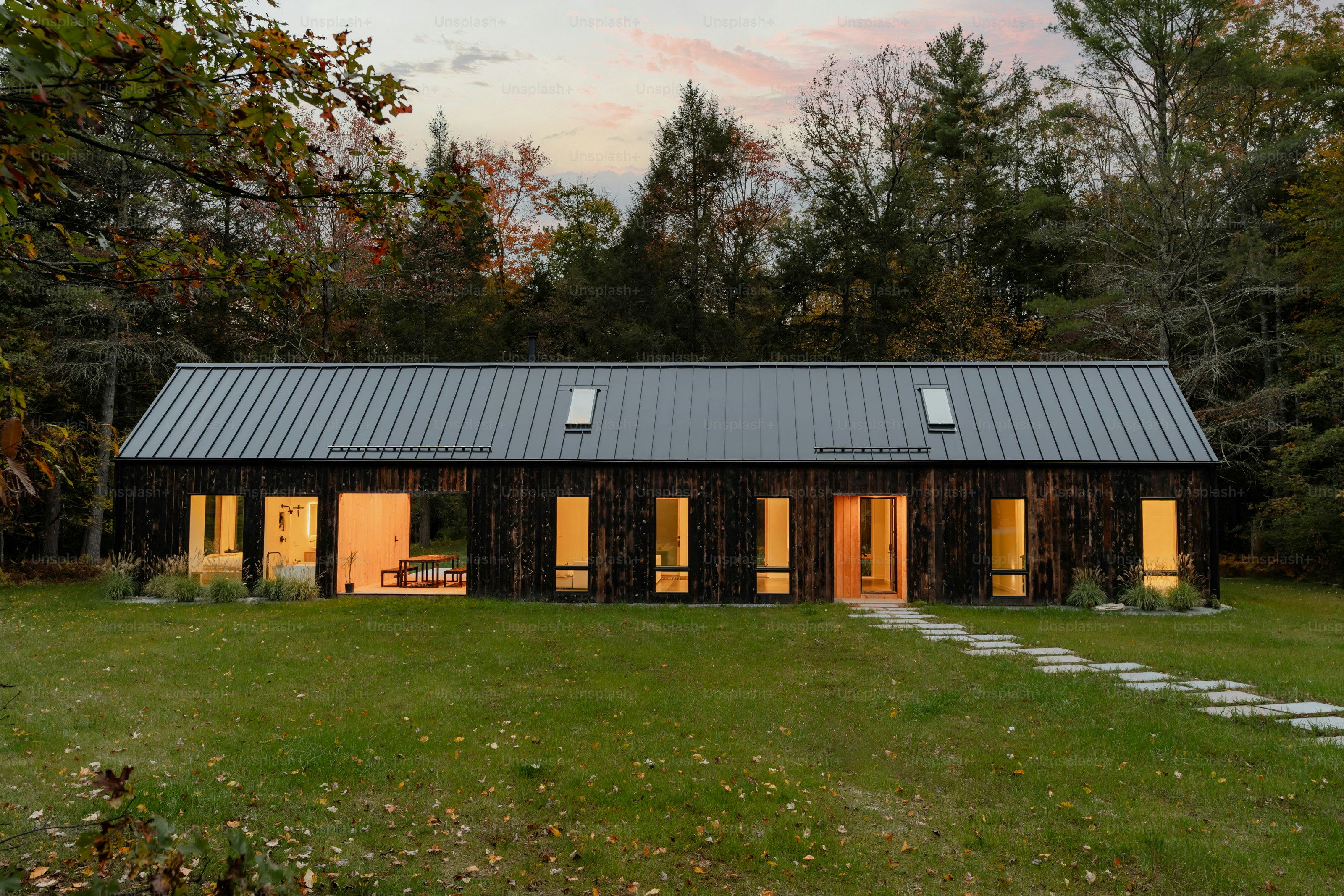 A small cabin in the middle of a field