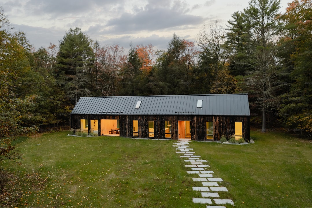 A house in the middle of a grassy field