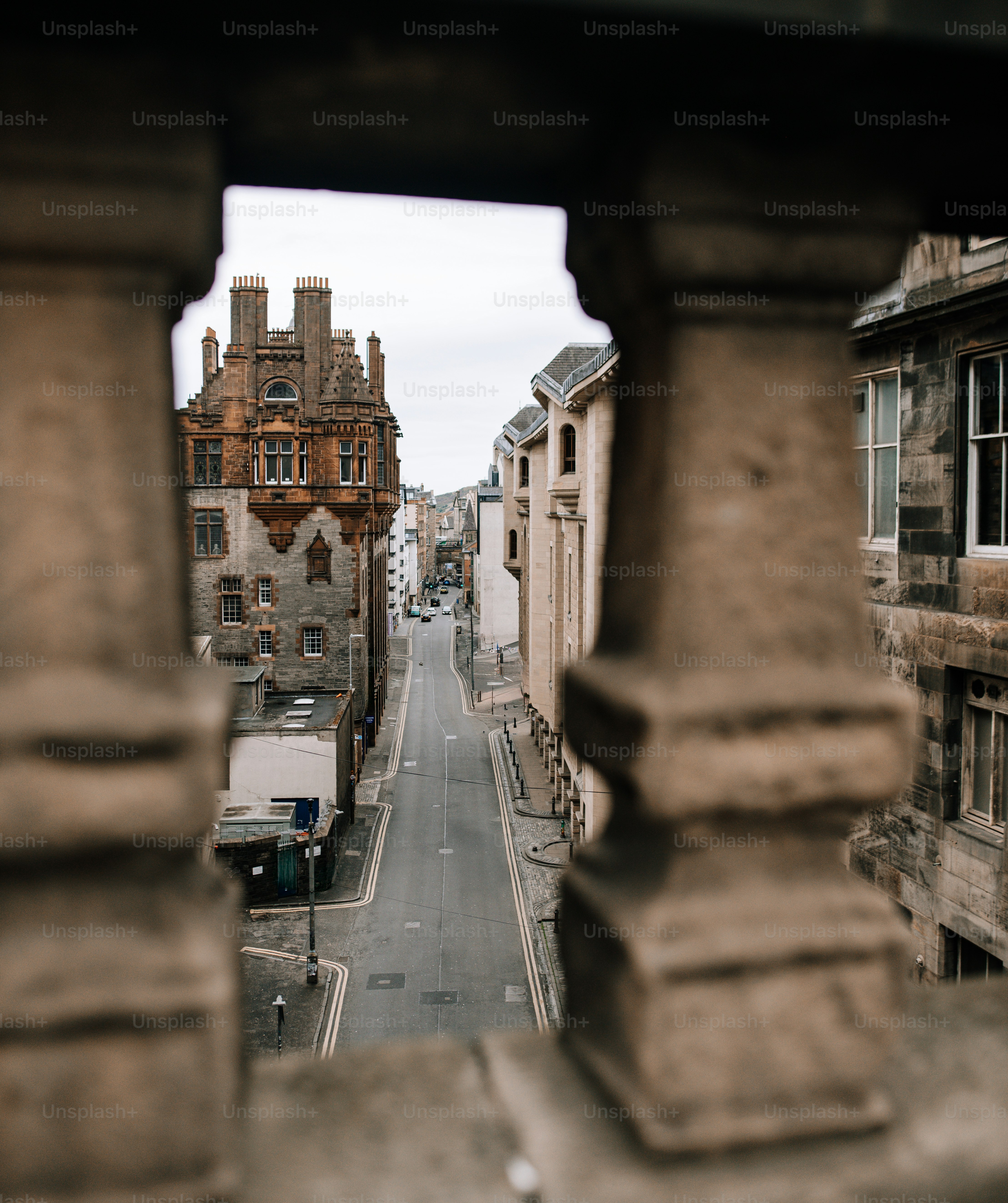 A view of a street from a window in a building photo – Green Image on ...