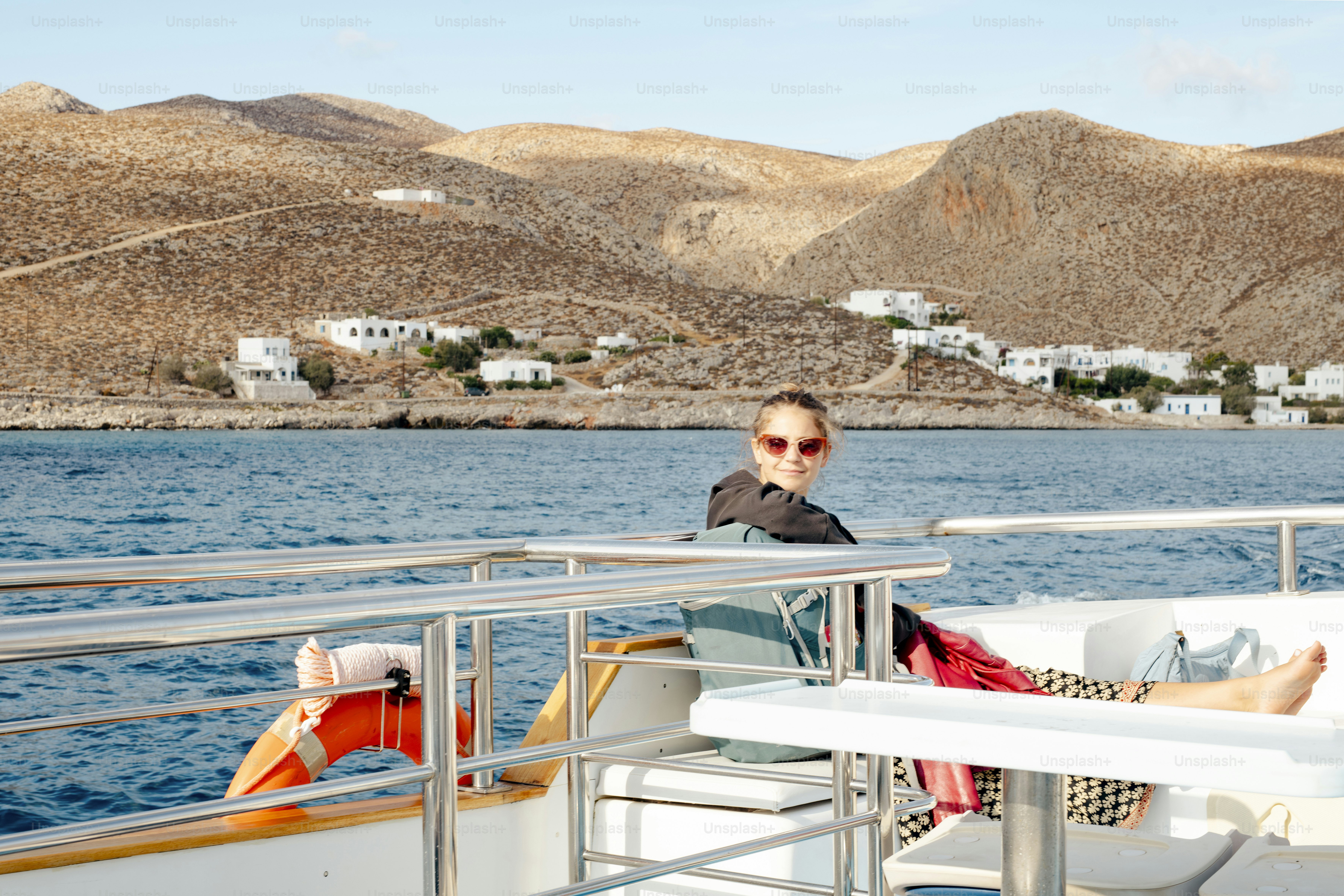 A man sitting on a boat in the water