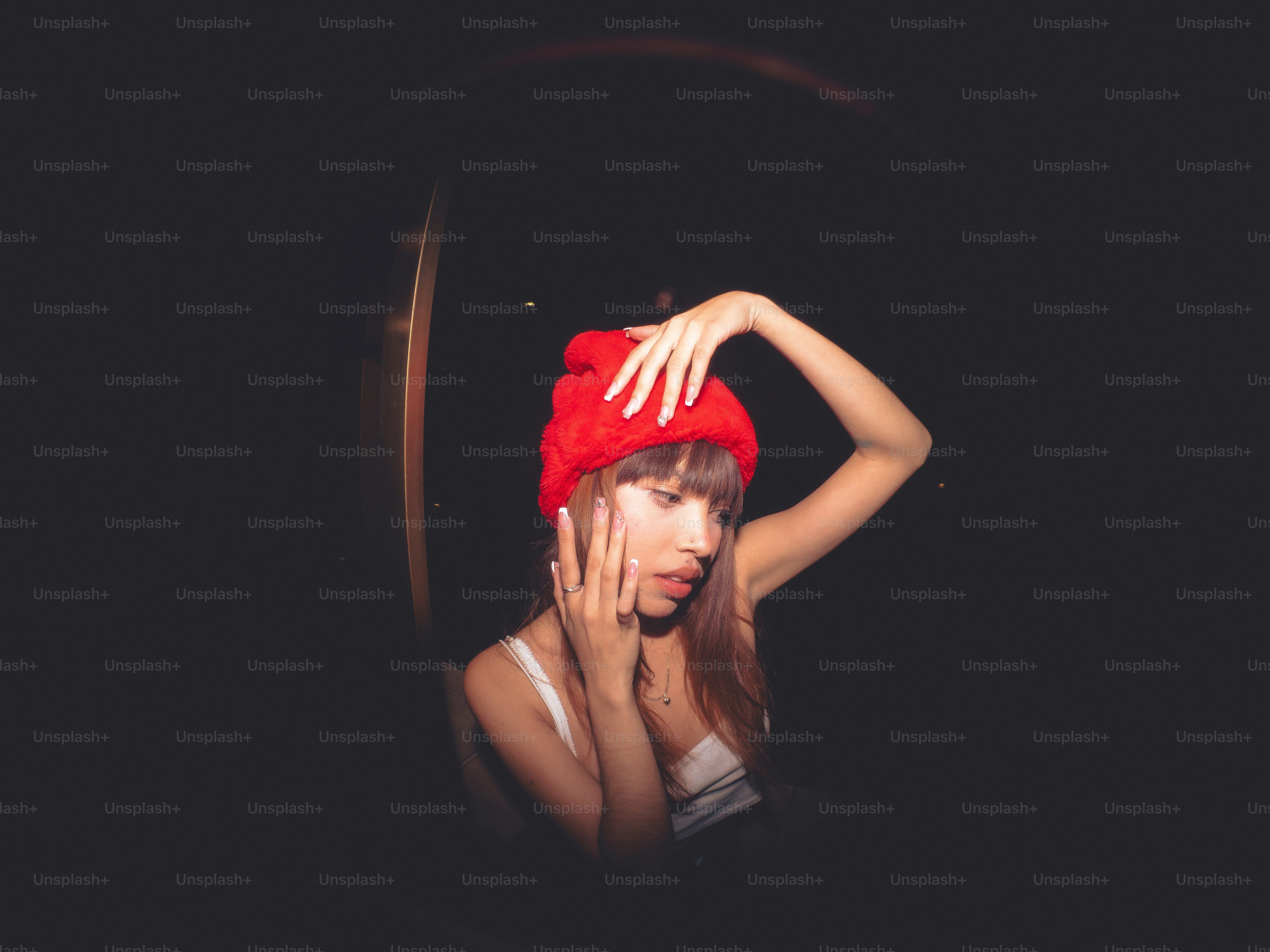 A woman with a red hat on her head