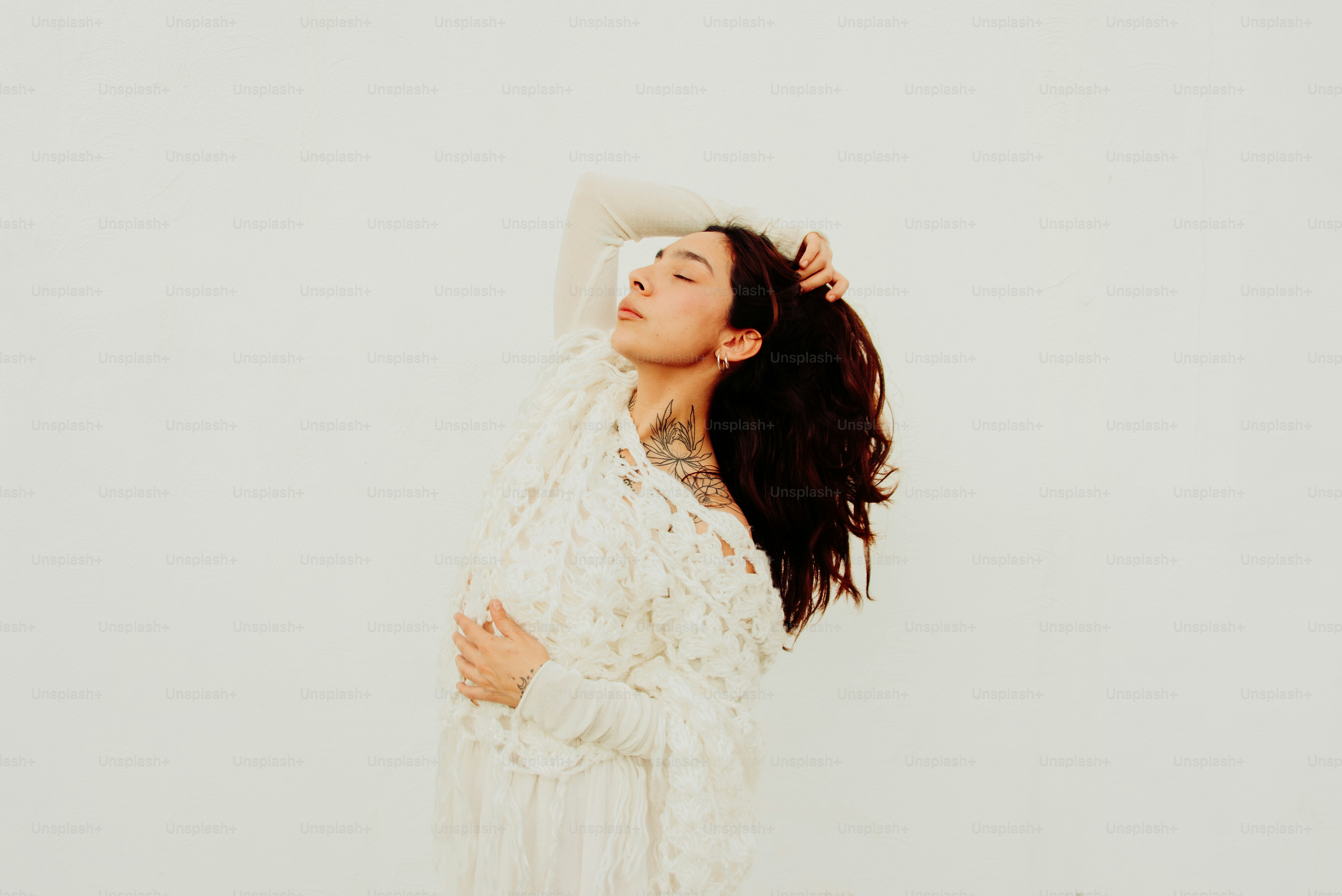 A woman in a white dress is posing for a picture photo – Beauty Image ...