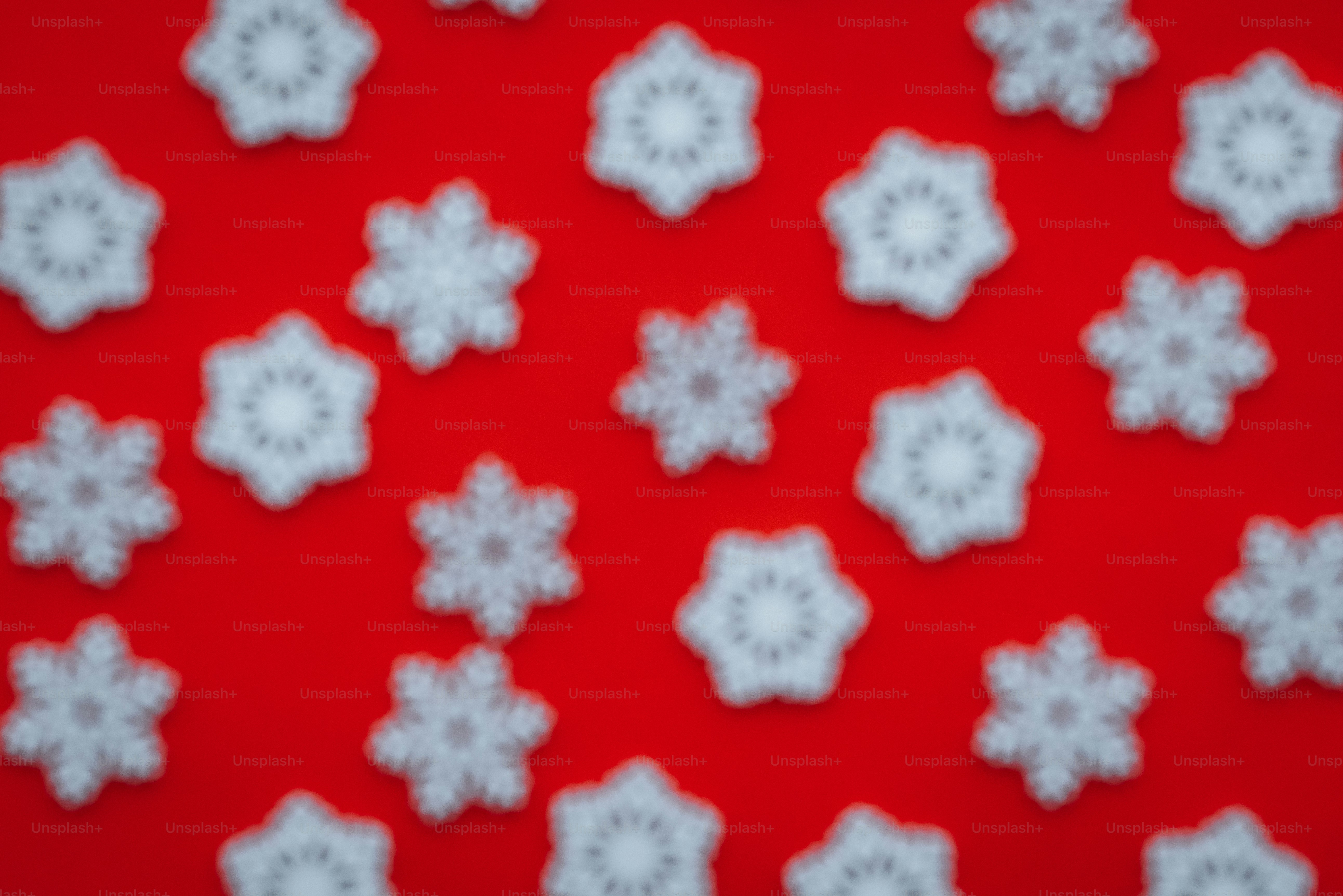A red background with white snowflakes on it