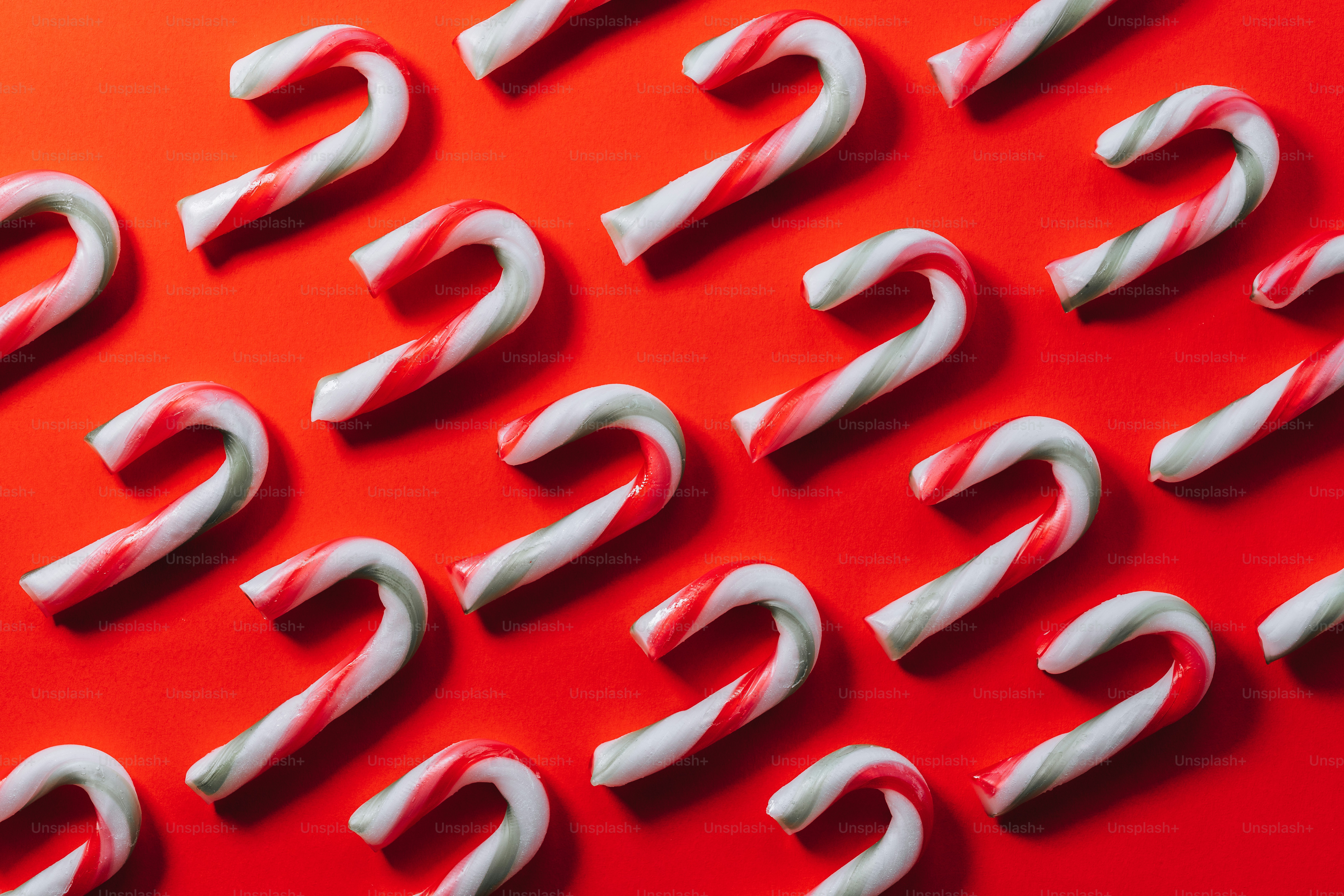 A close up of a number of red and white candy canes