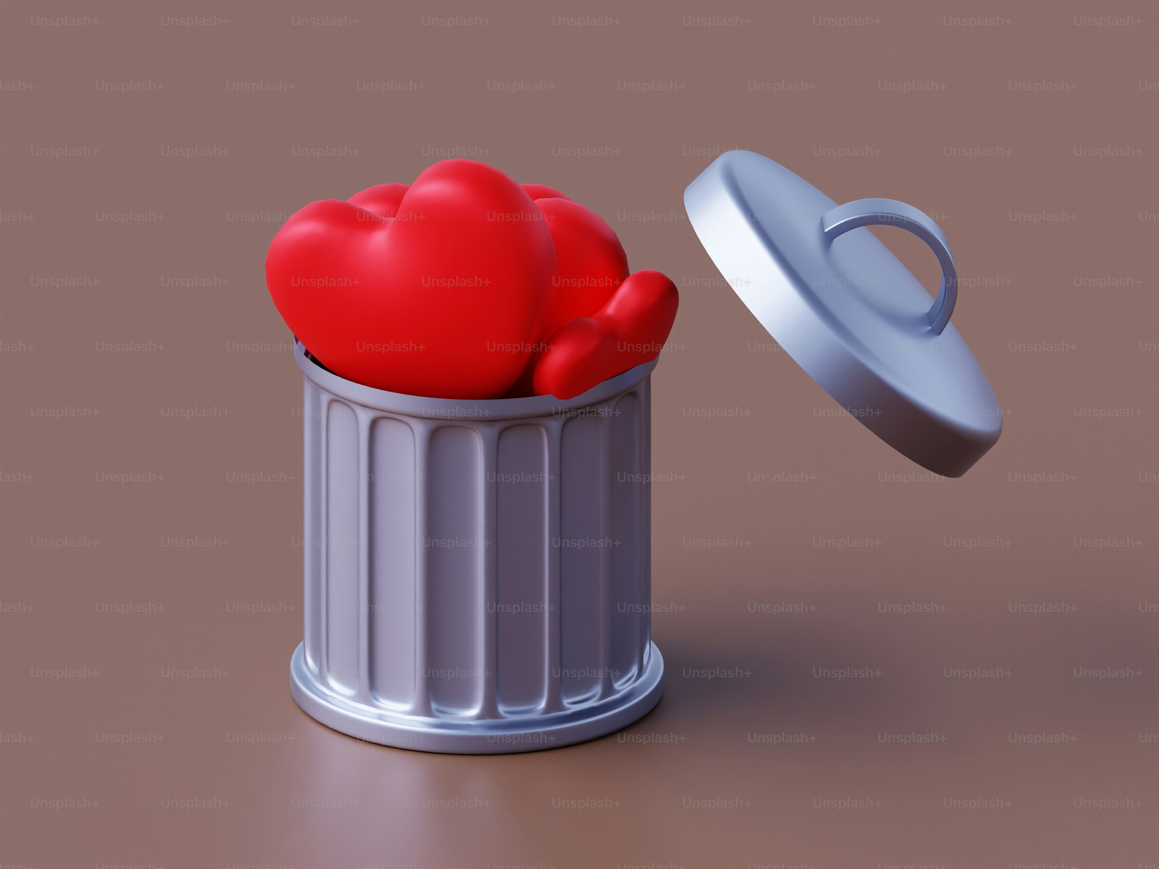 A red heart sitting inside of a trash can