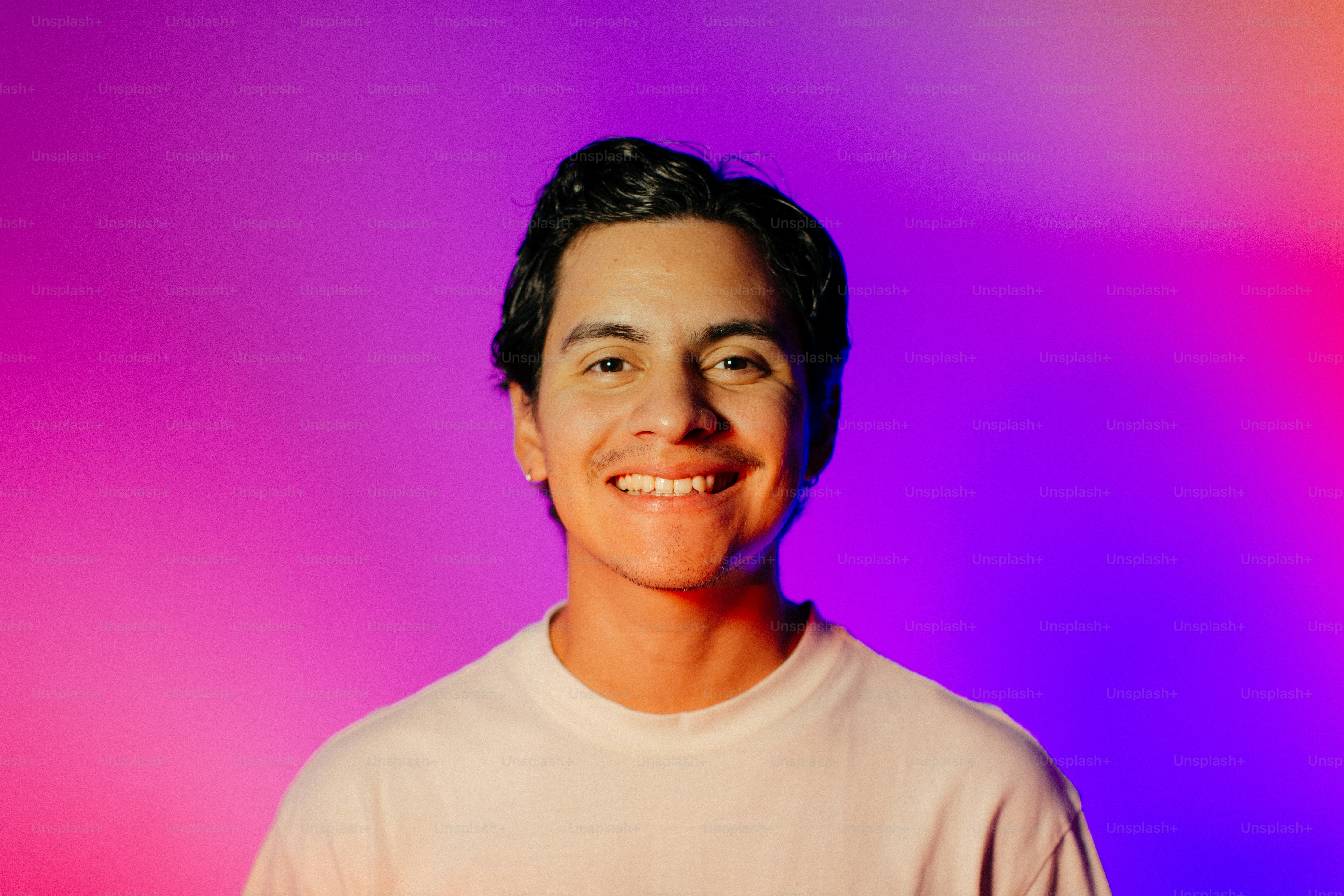 A man standing in front of a colorful background photo – Portrait Image ...