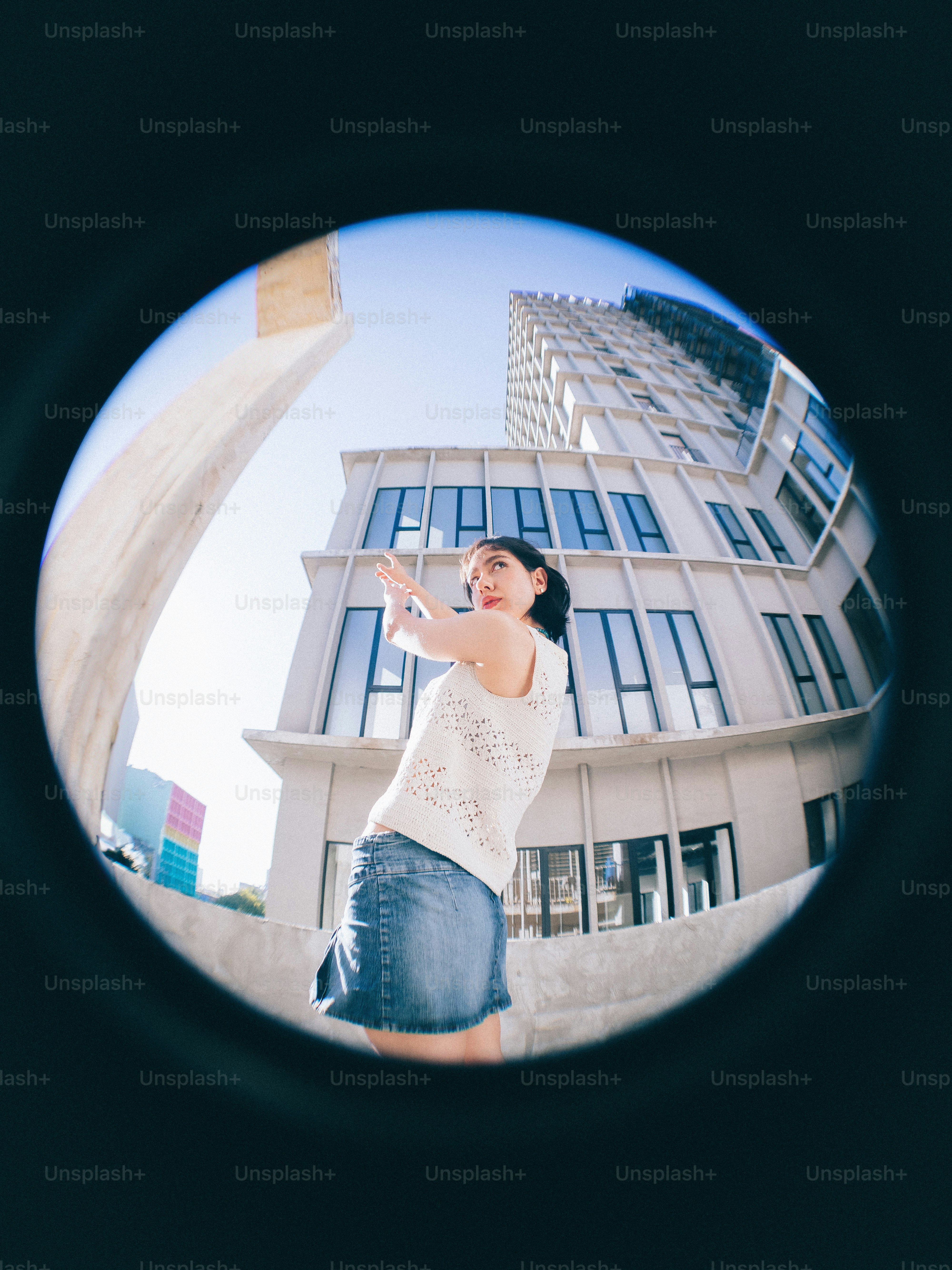 A woman standing in front of a tall building