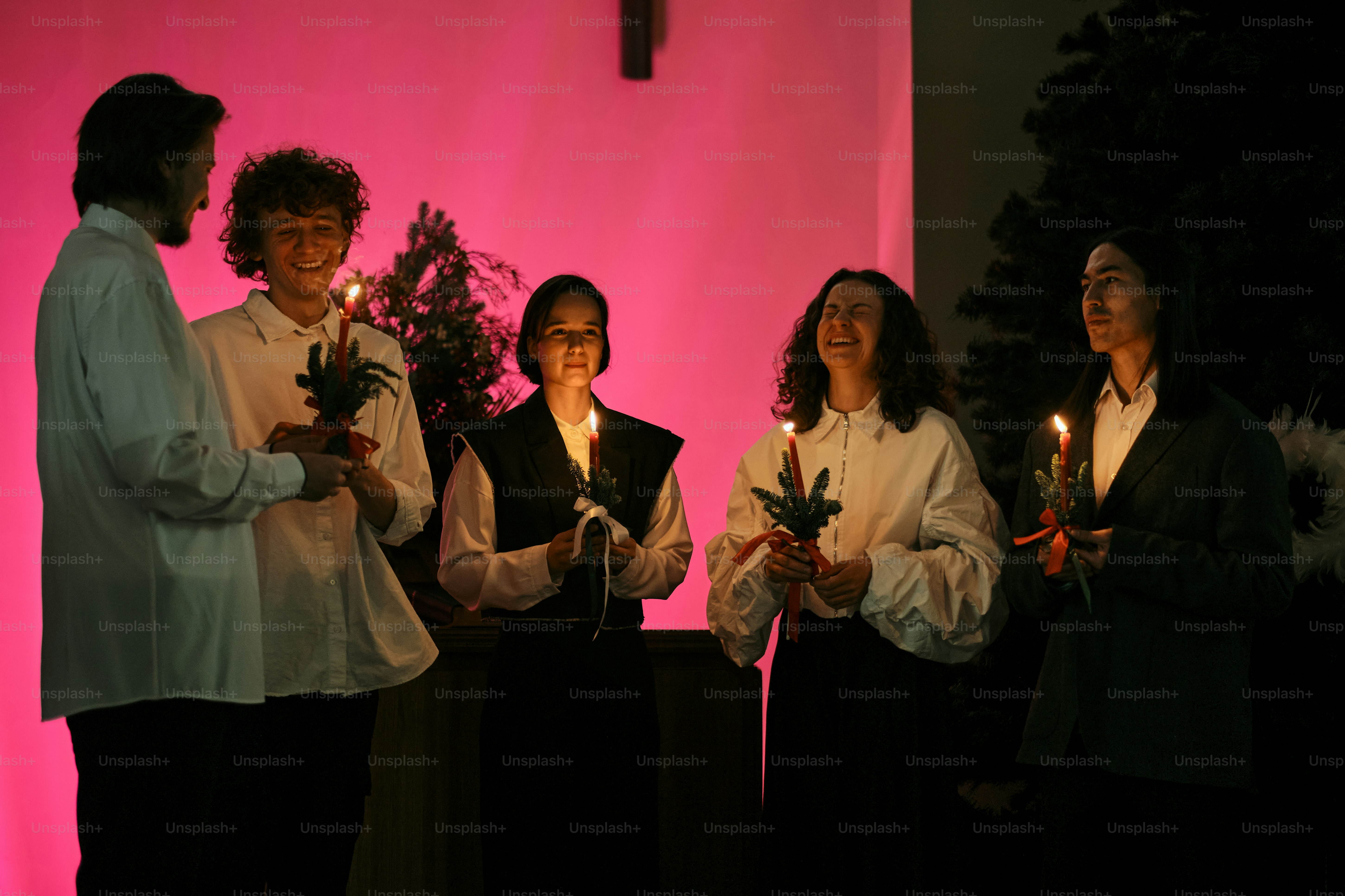 A group of people standing in front of a cross