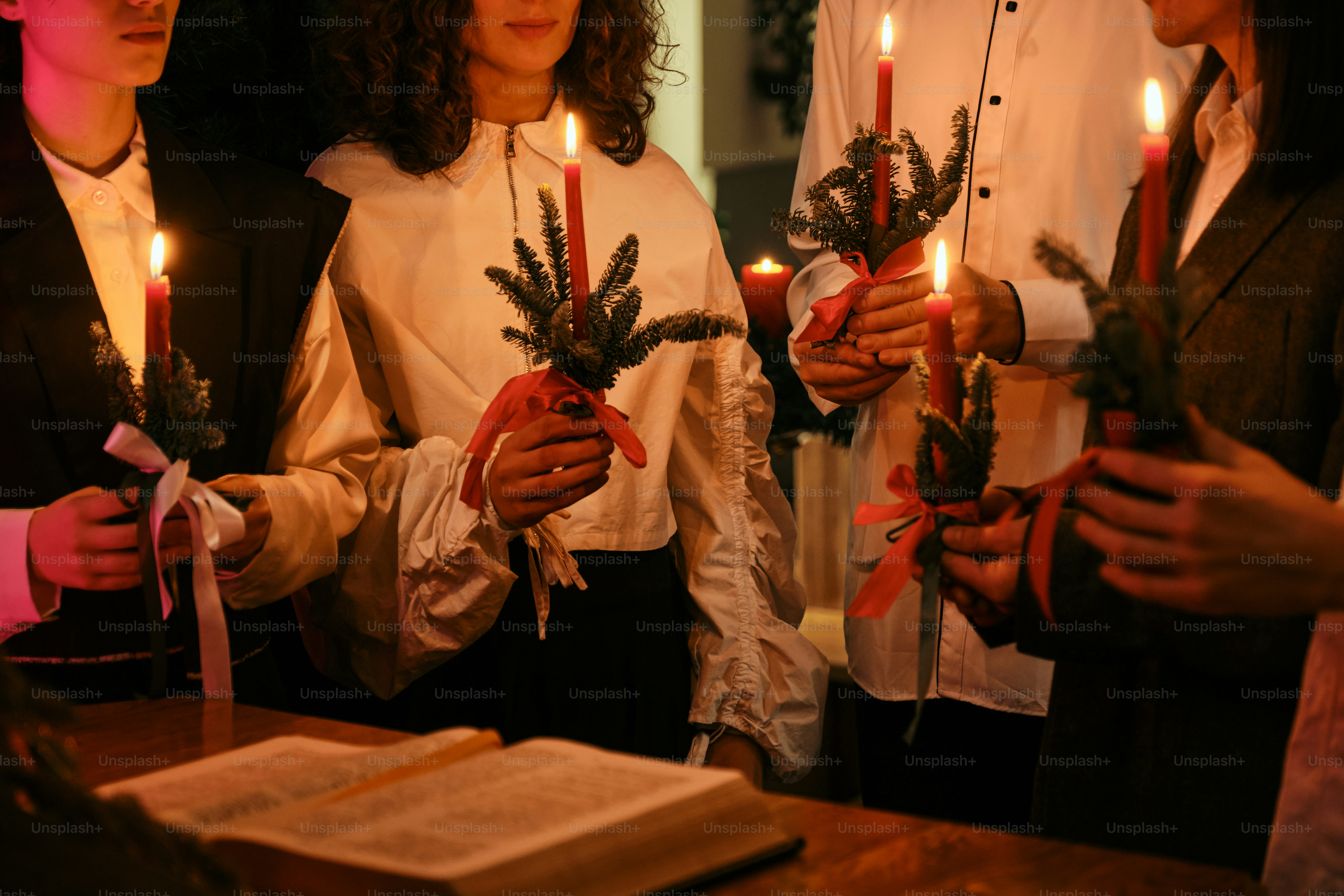 A group of people holding candles in their hands