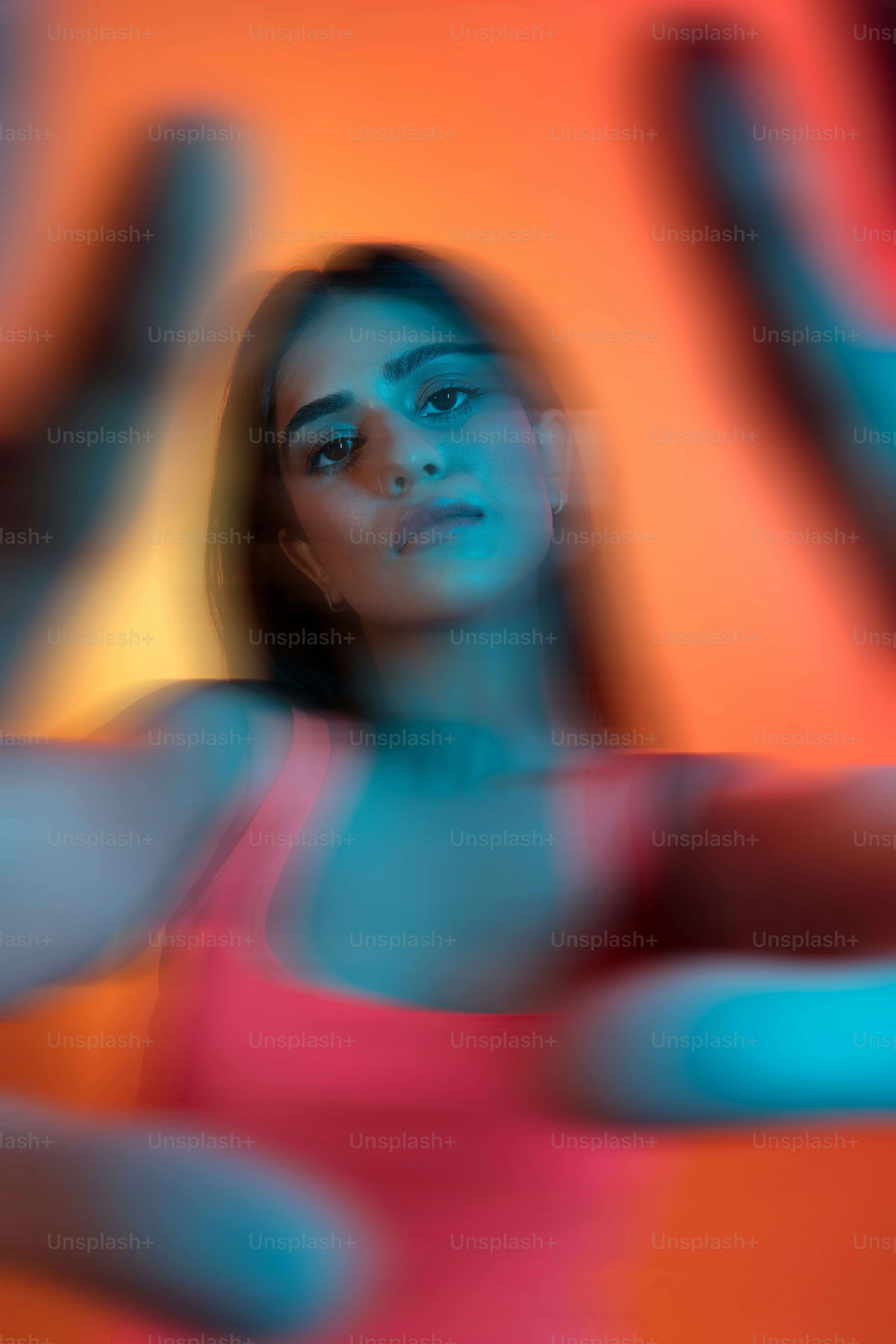 A blurry photo of a woman in a pink top