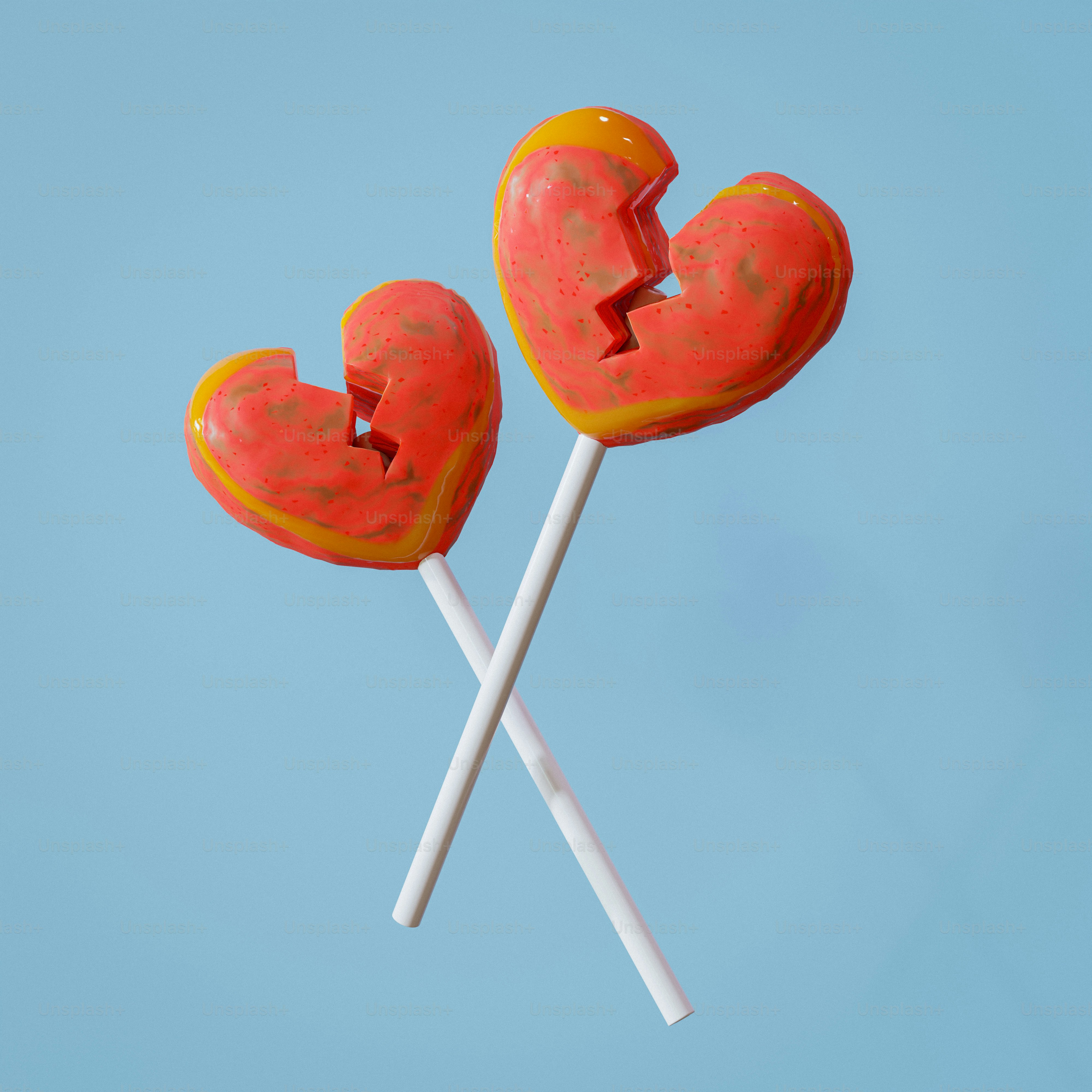 Ein paar herzförmige Lutscher am Stiel