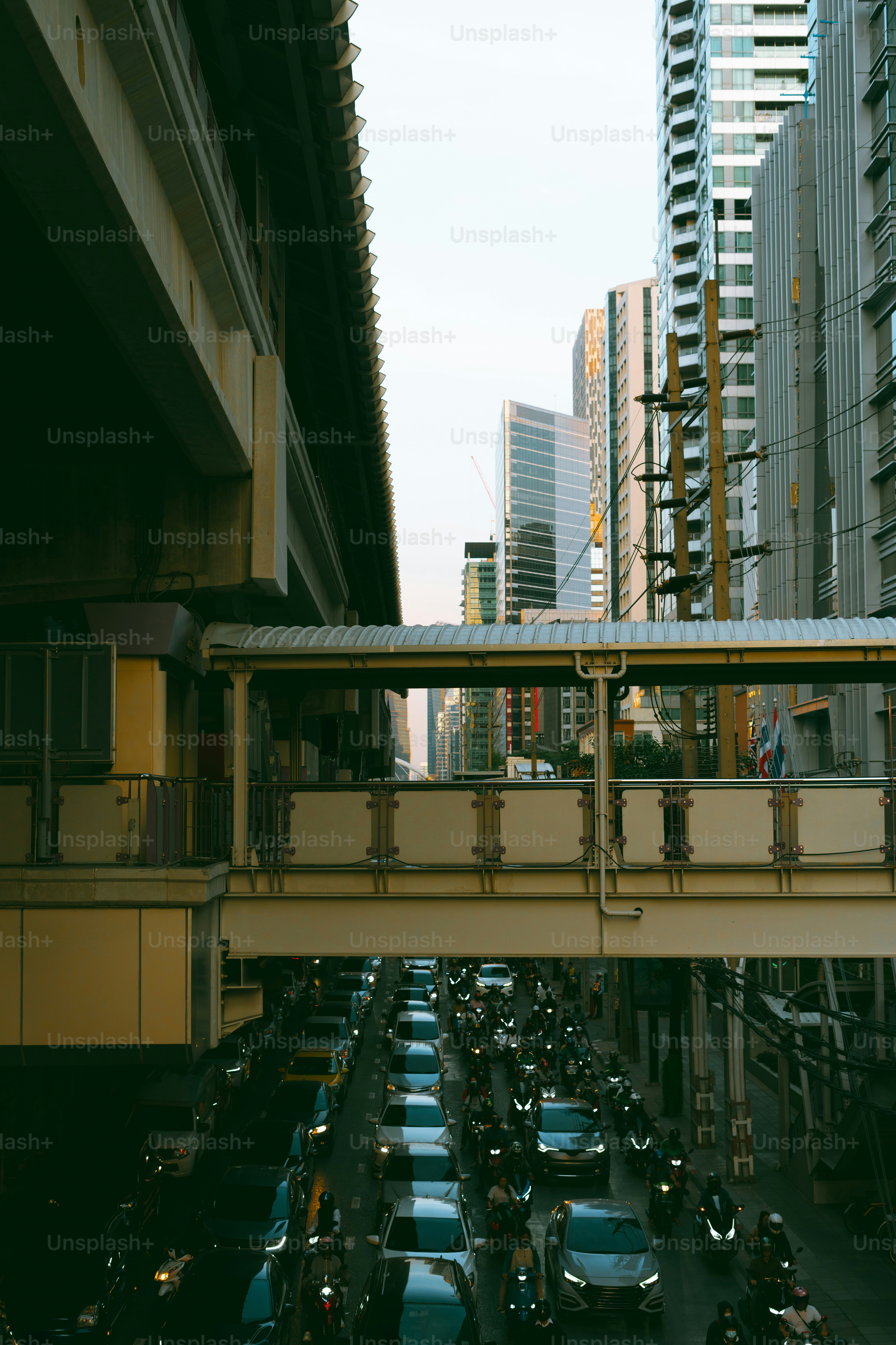 A street filled with lots of traffic next to tall buildings