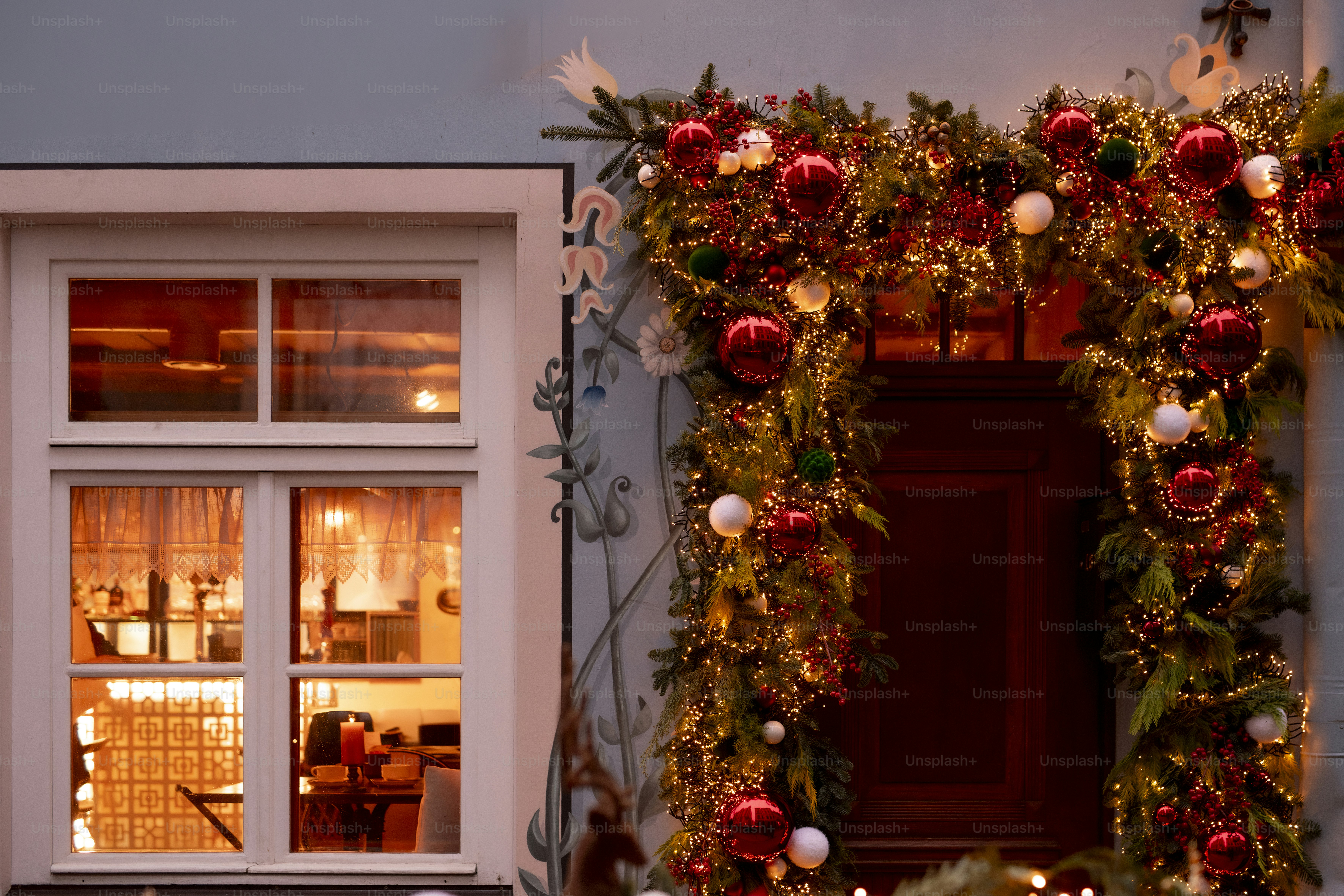A christmas wreath on the side of a building