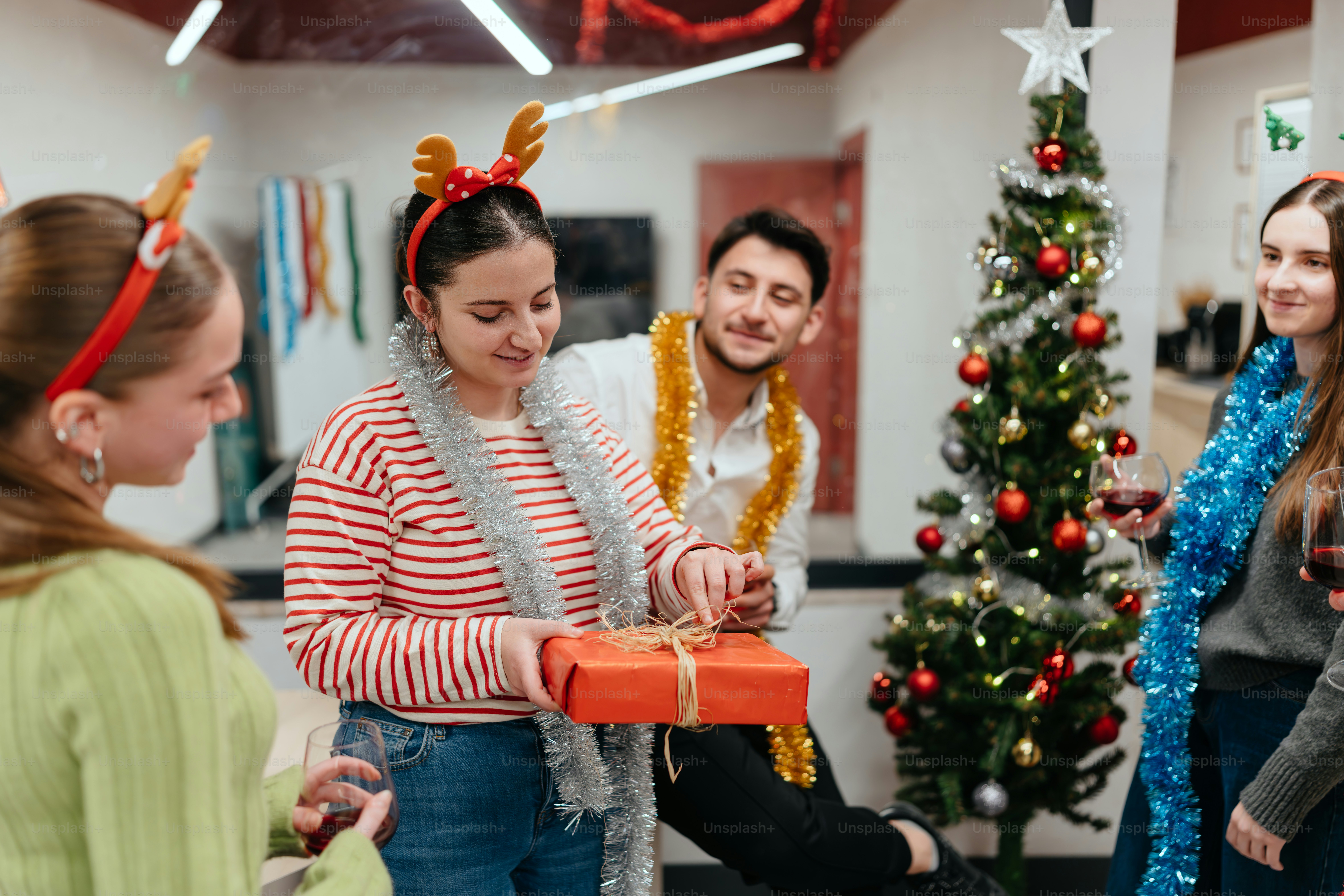 A group of people standing around each other photo – Christmas Image on ...