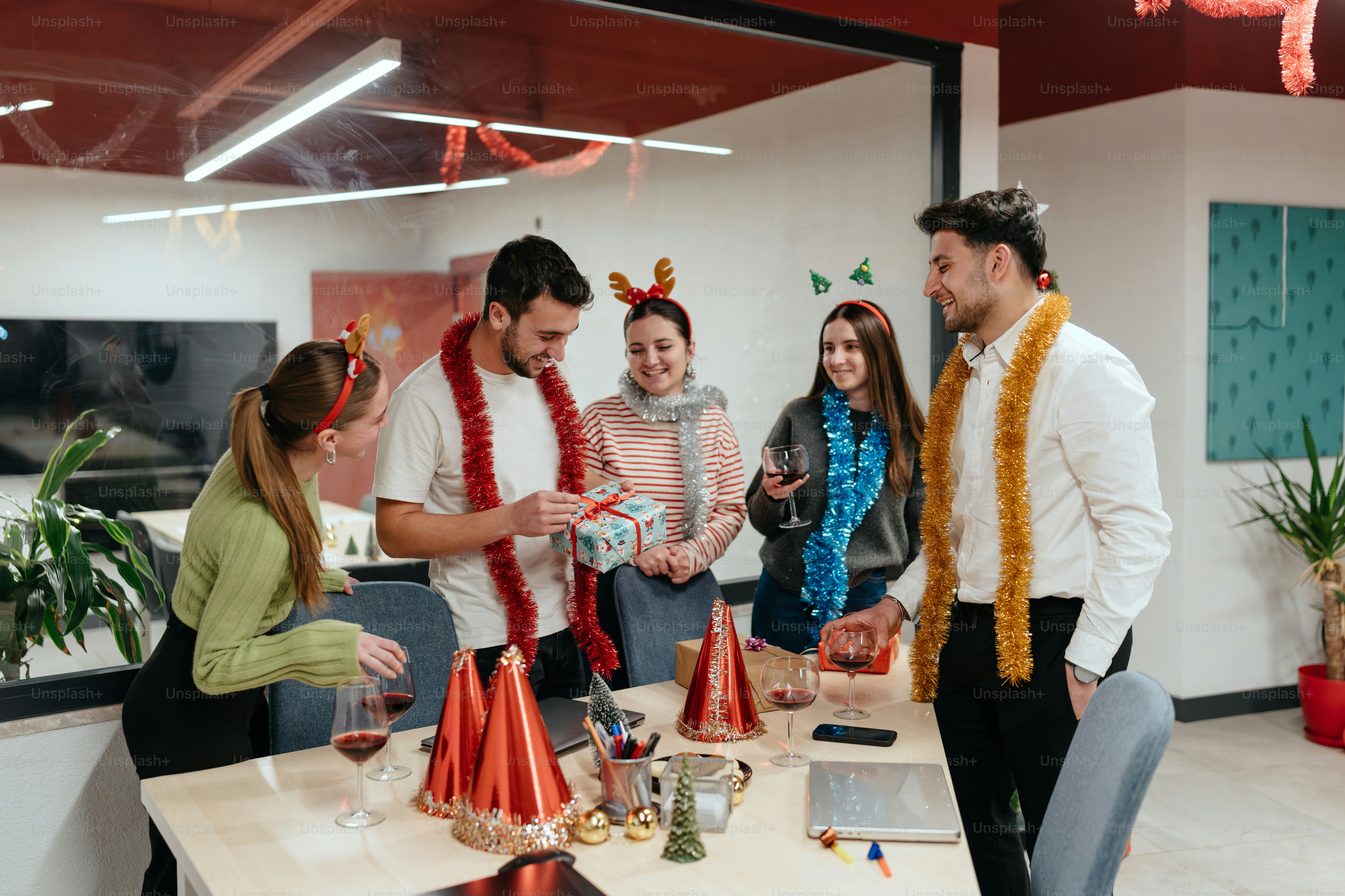 A group of people standing around a table photo – Office Image on Unsplash