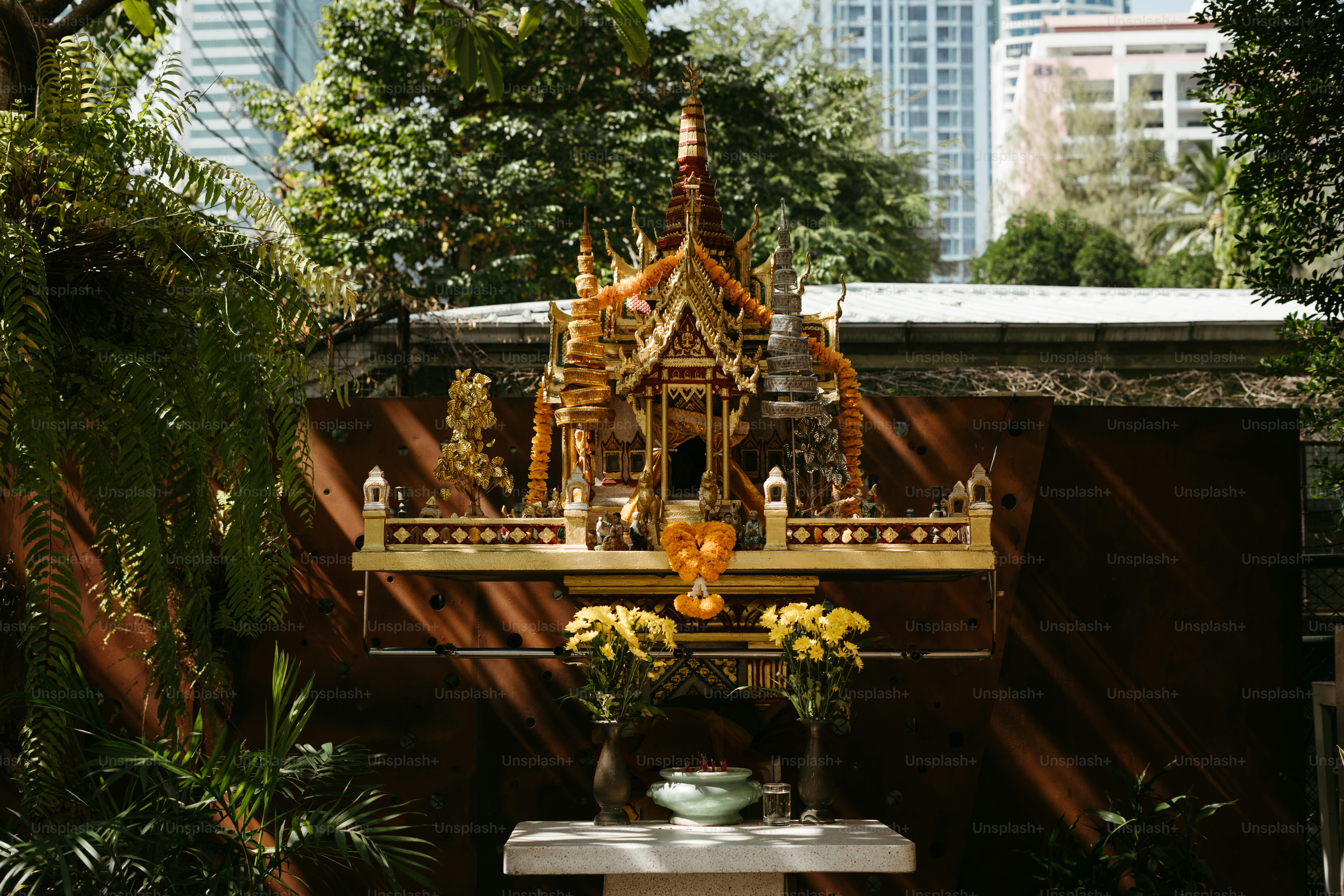 A statue of a buddha in a garden