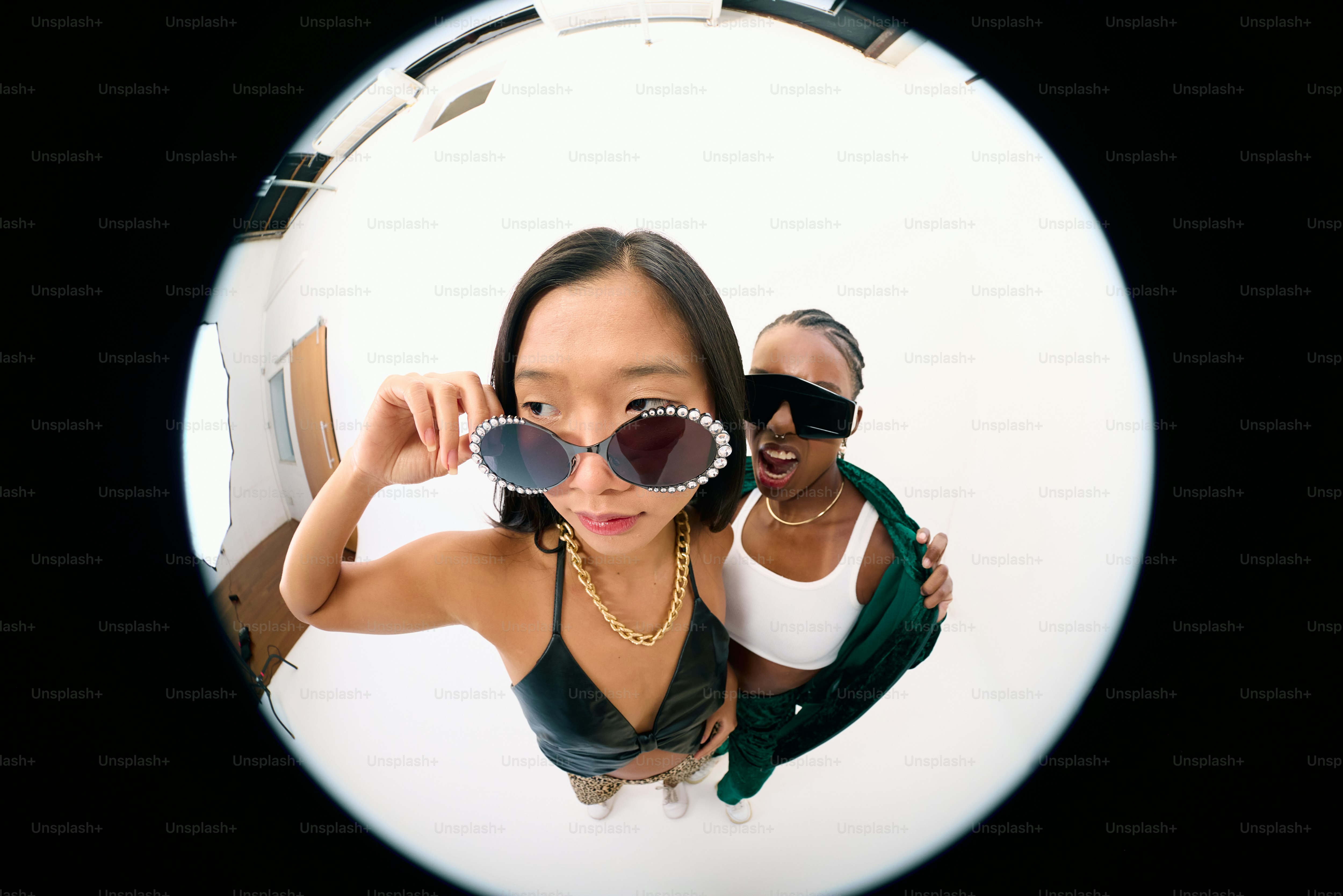 A woman in a black tank top and a man in a green shirt