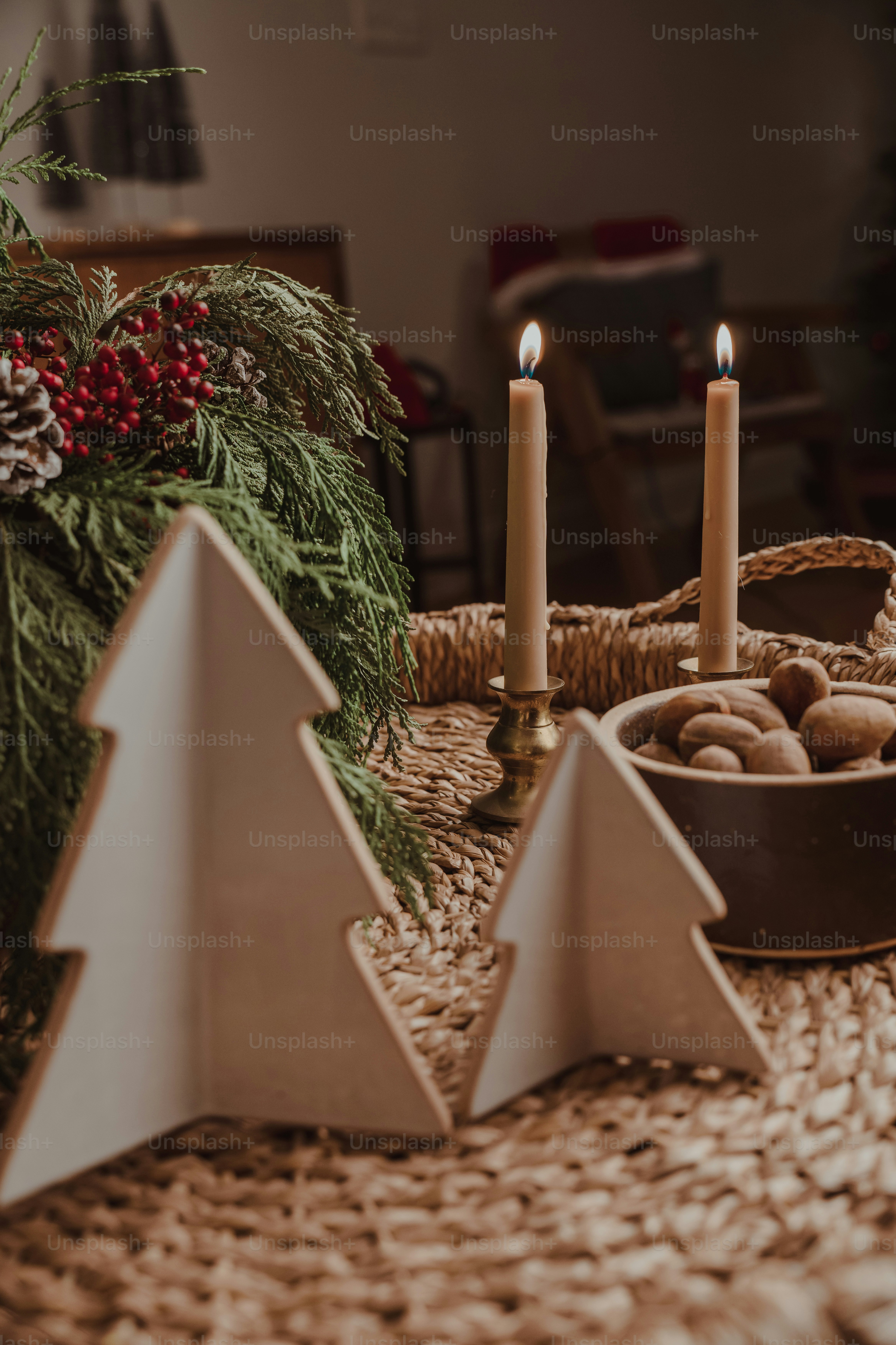 A table with a basket of cookies and candles