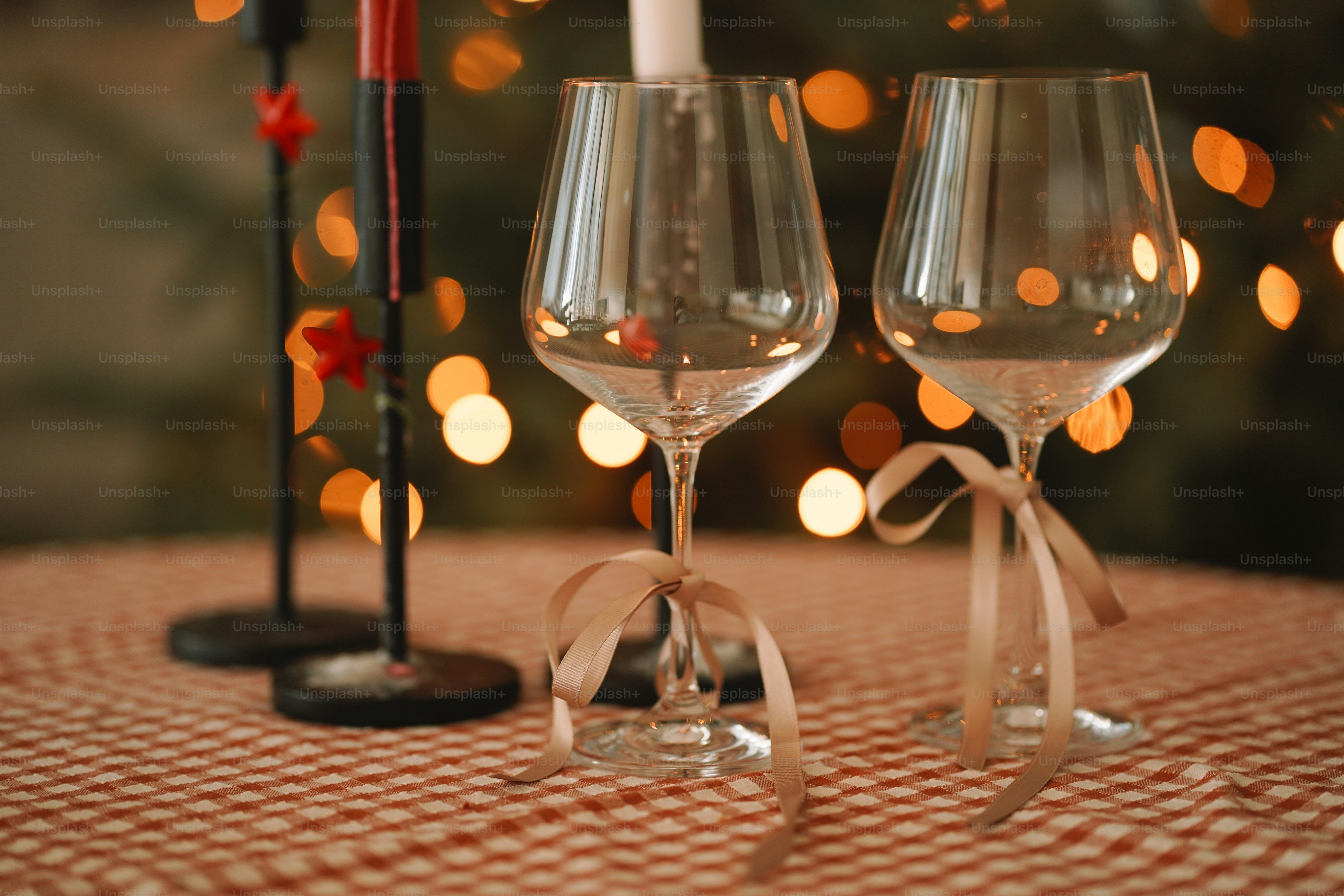 Two wine glasses sitting on top of a table