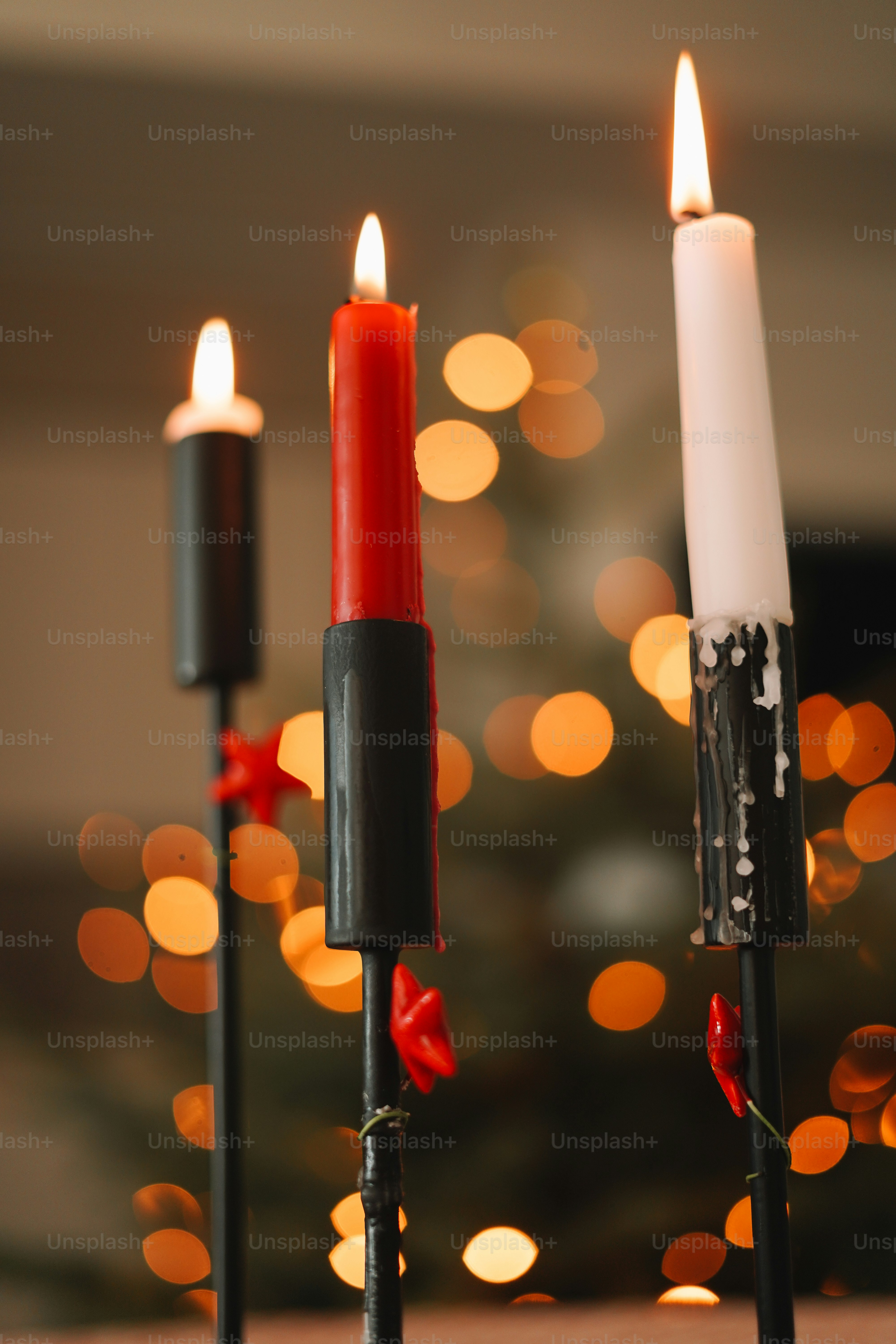 A couple of candles sitting on top of a table