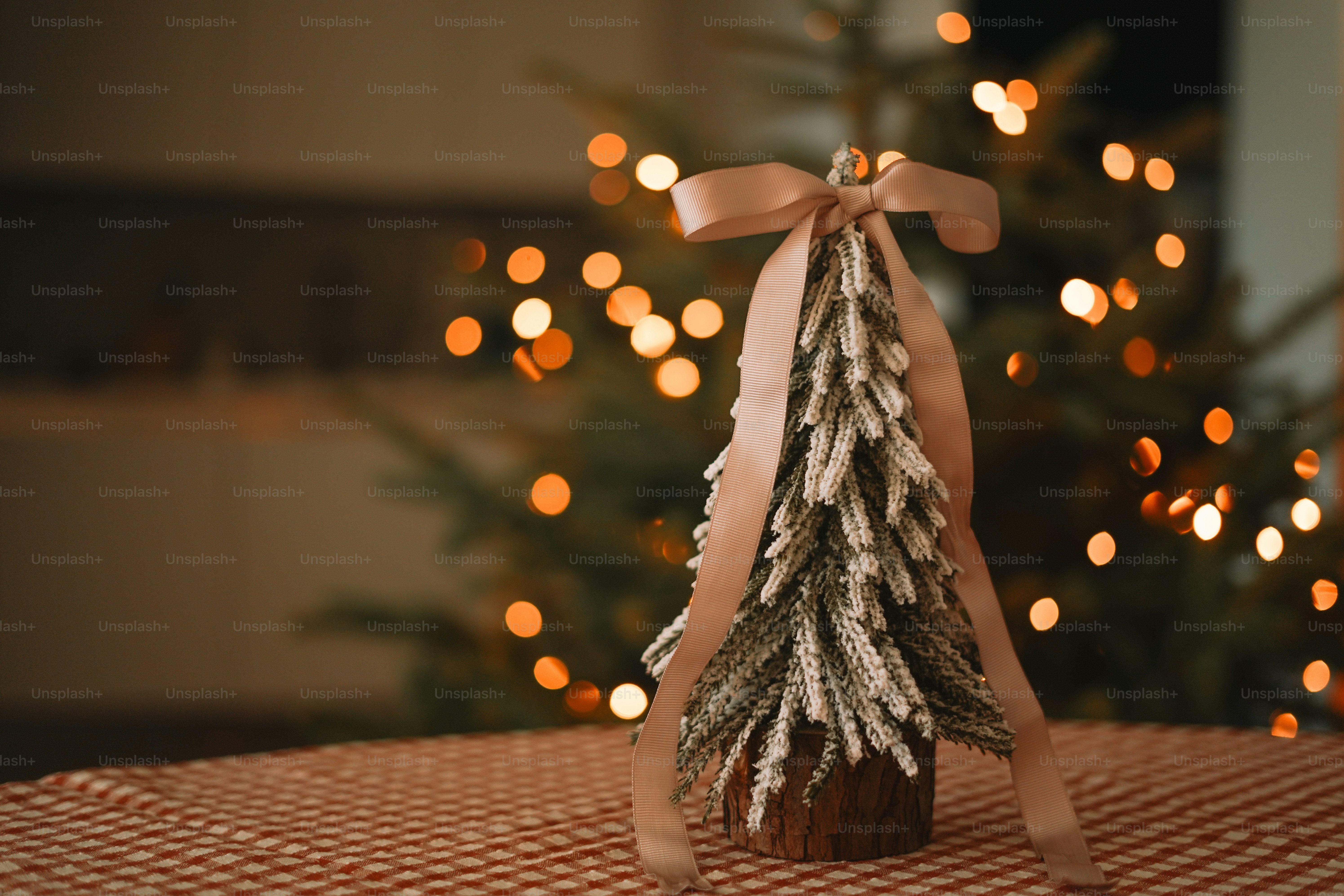 A small christmas tree sitting on top of a table