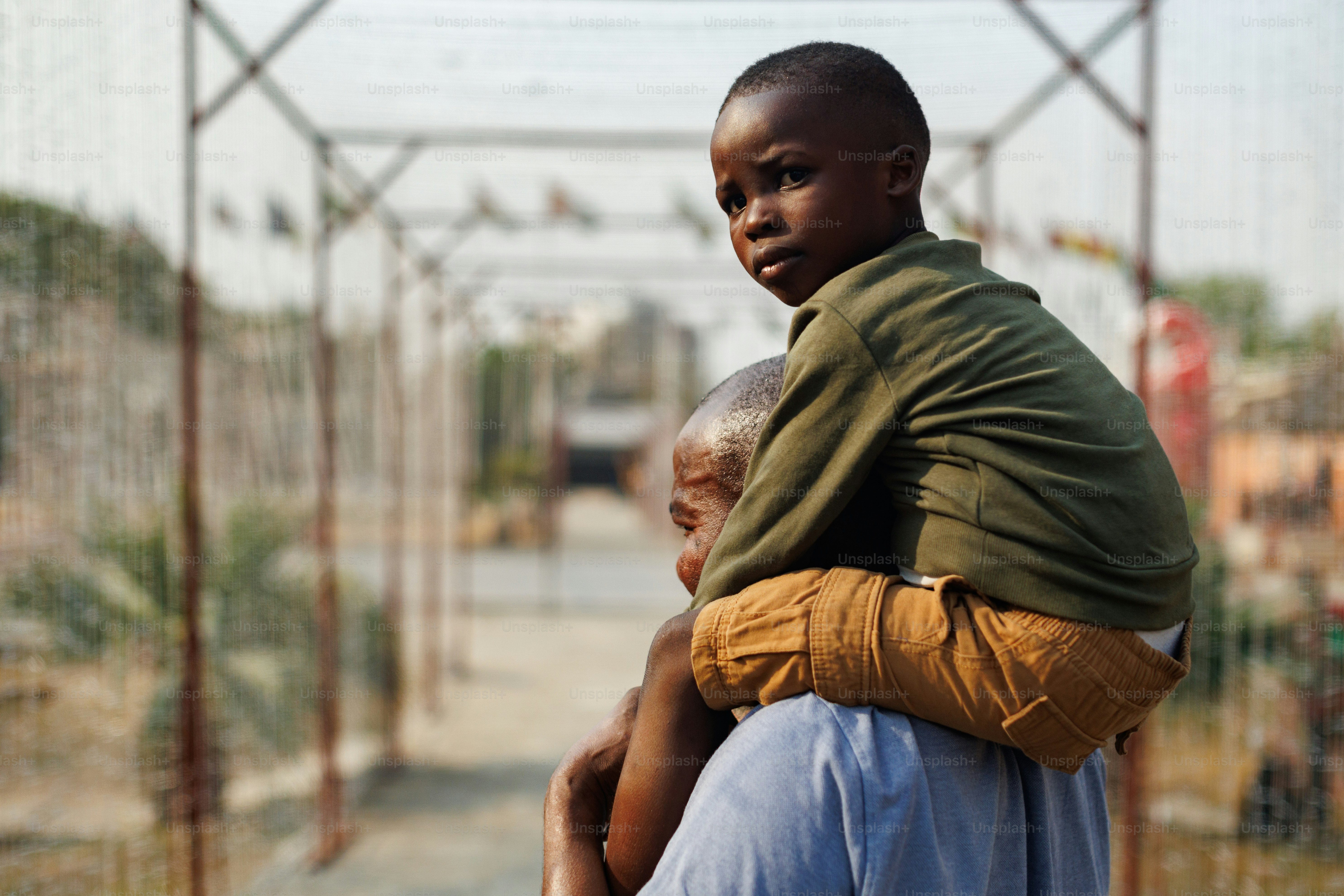 A man holding a child in his arms