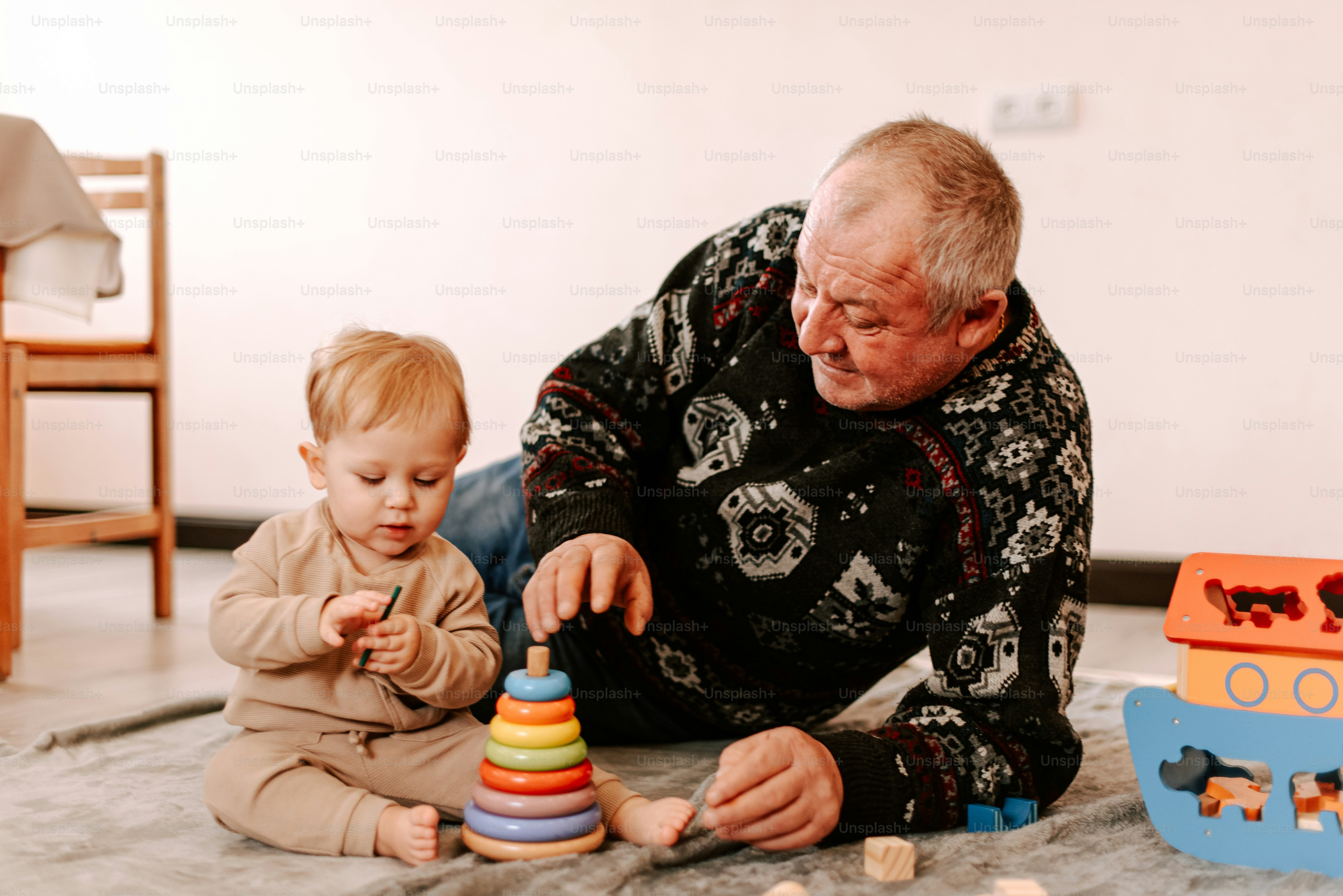 A man playing with a child on the floor