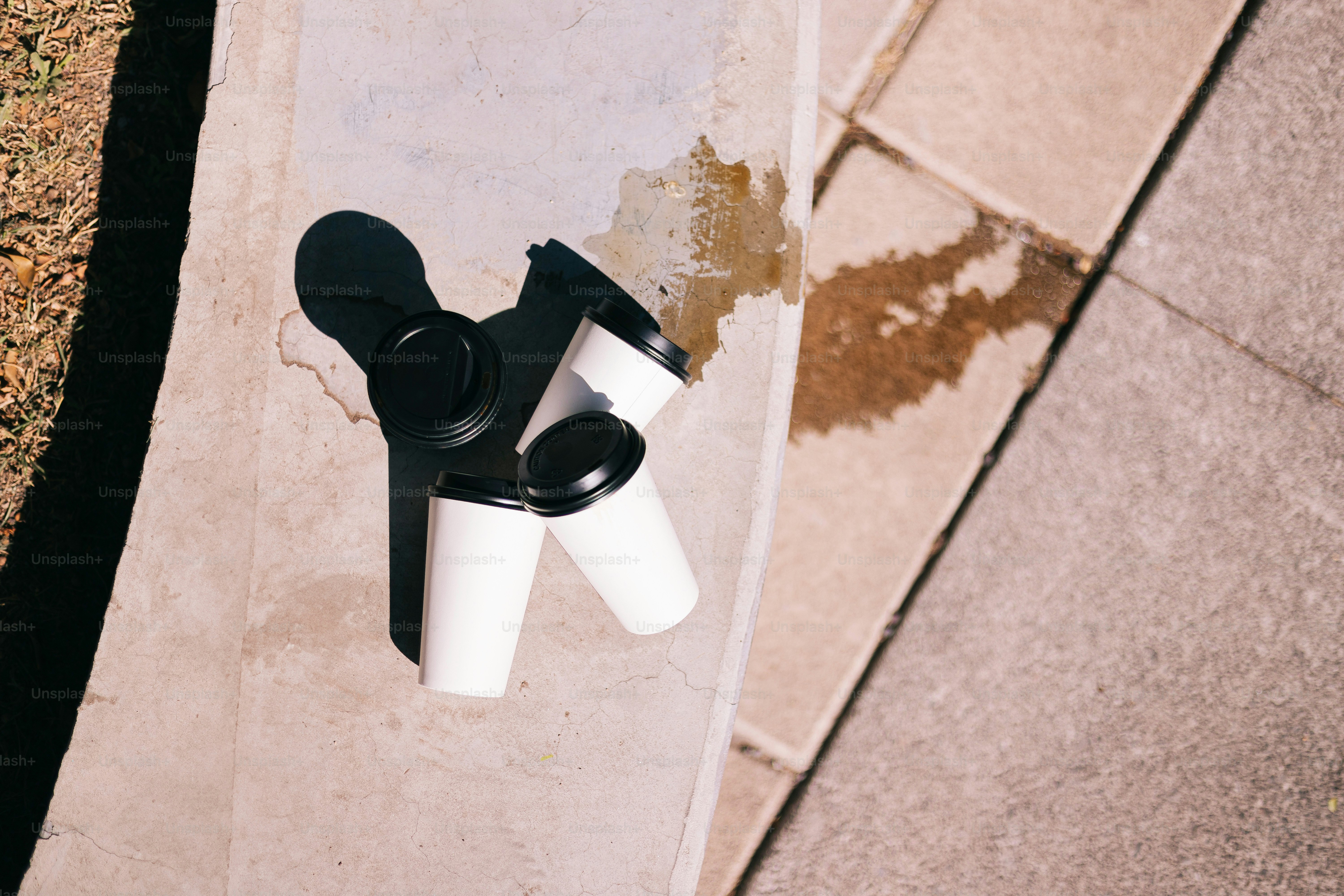 A black and white object on a sidewalk