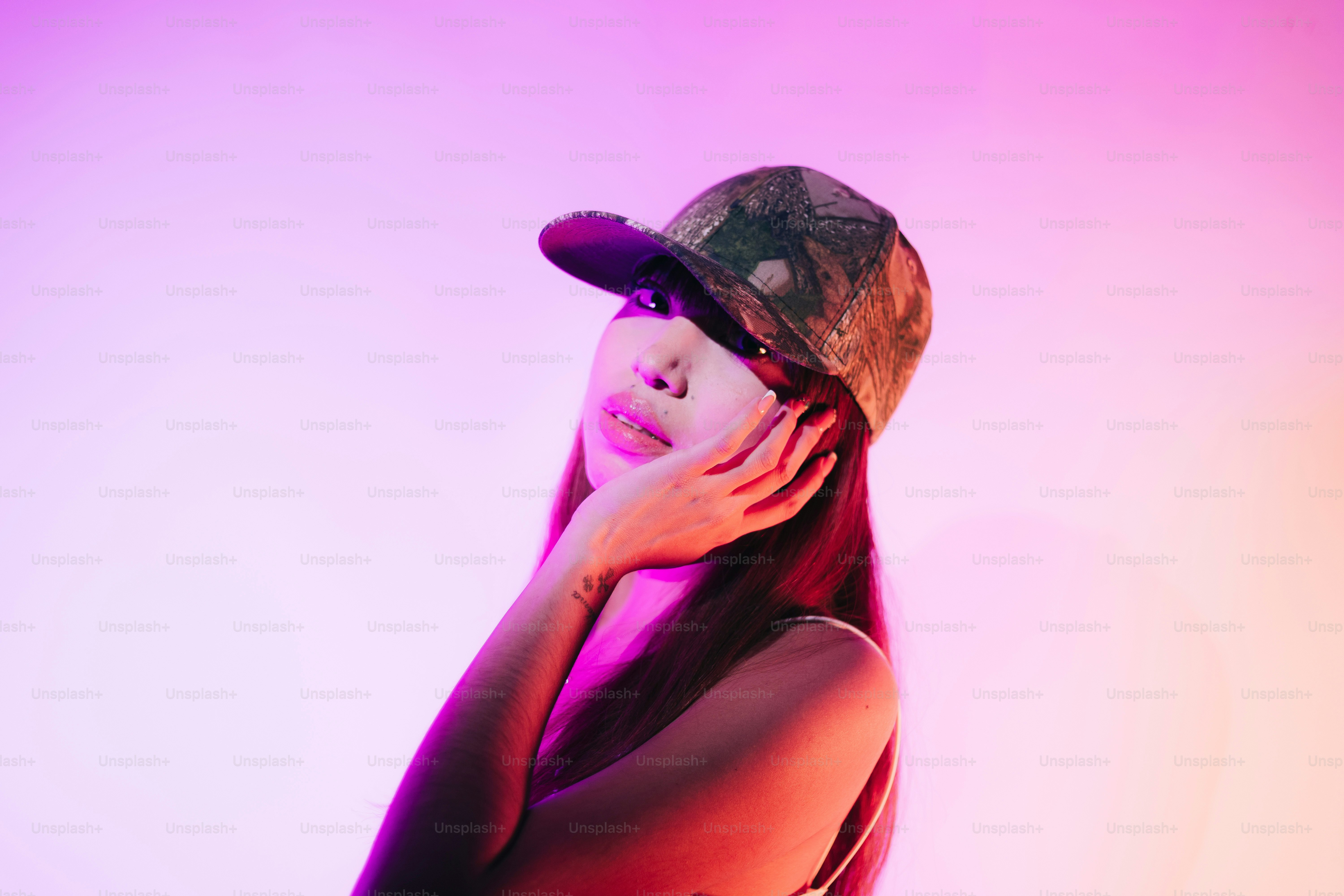 A woman with a hat on her head posing for a picture photo – Portrait ...