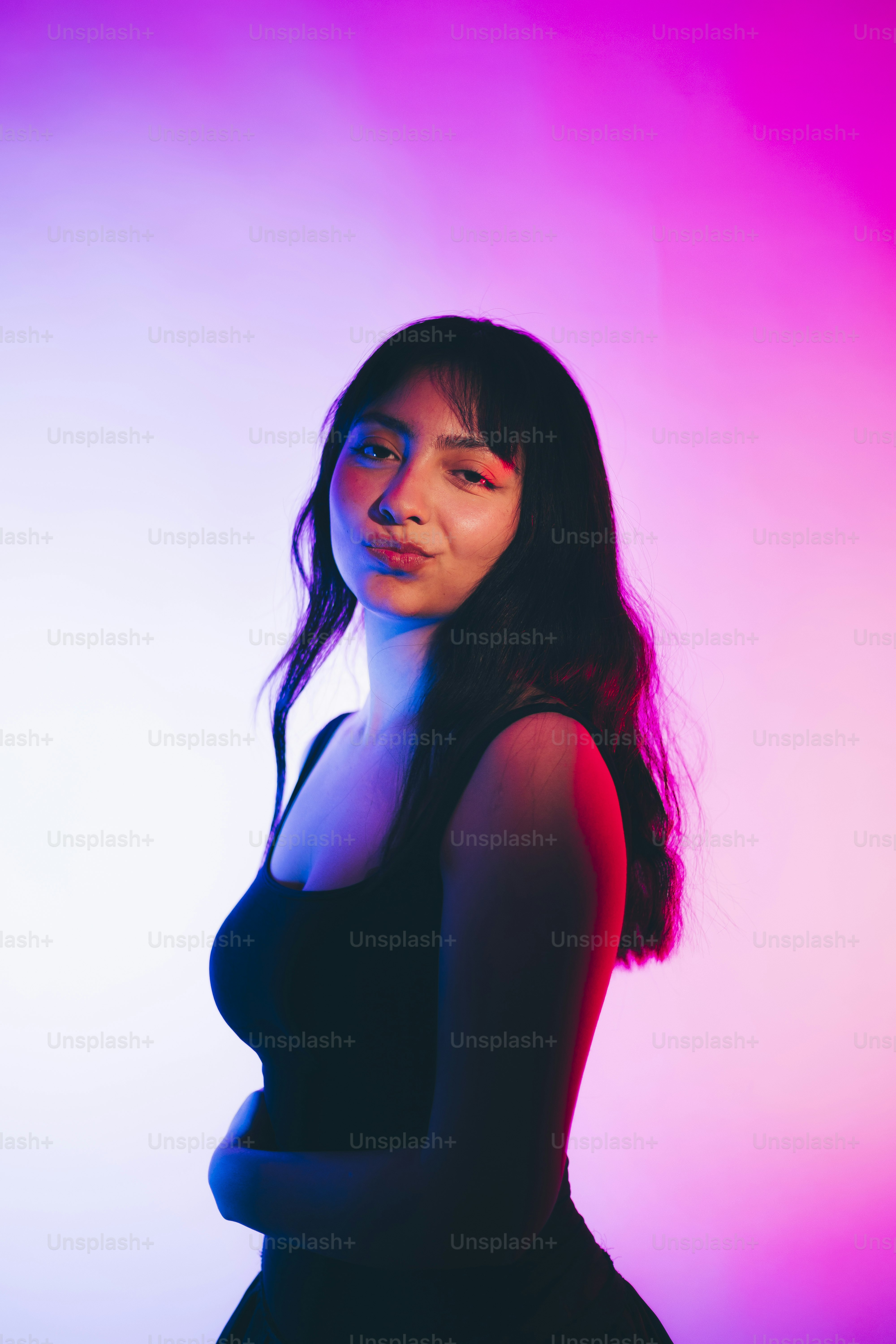 A woman in a black dress posing for a picture photo – Portrait Image on ...