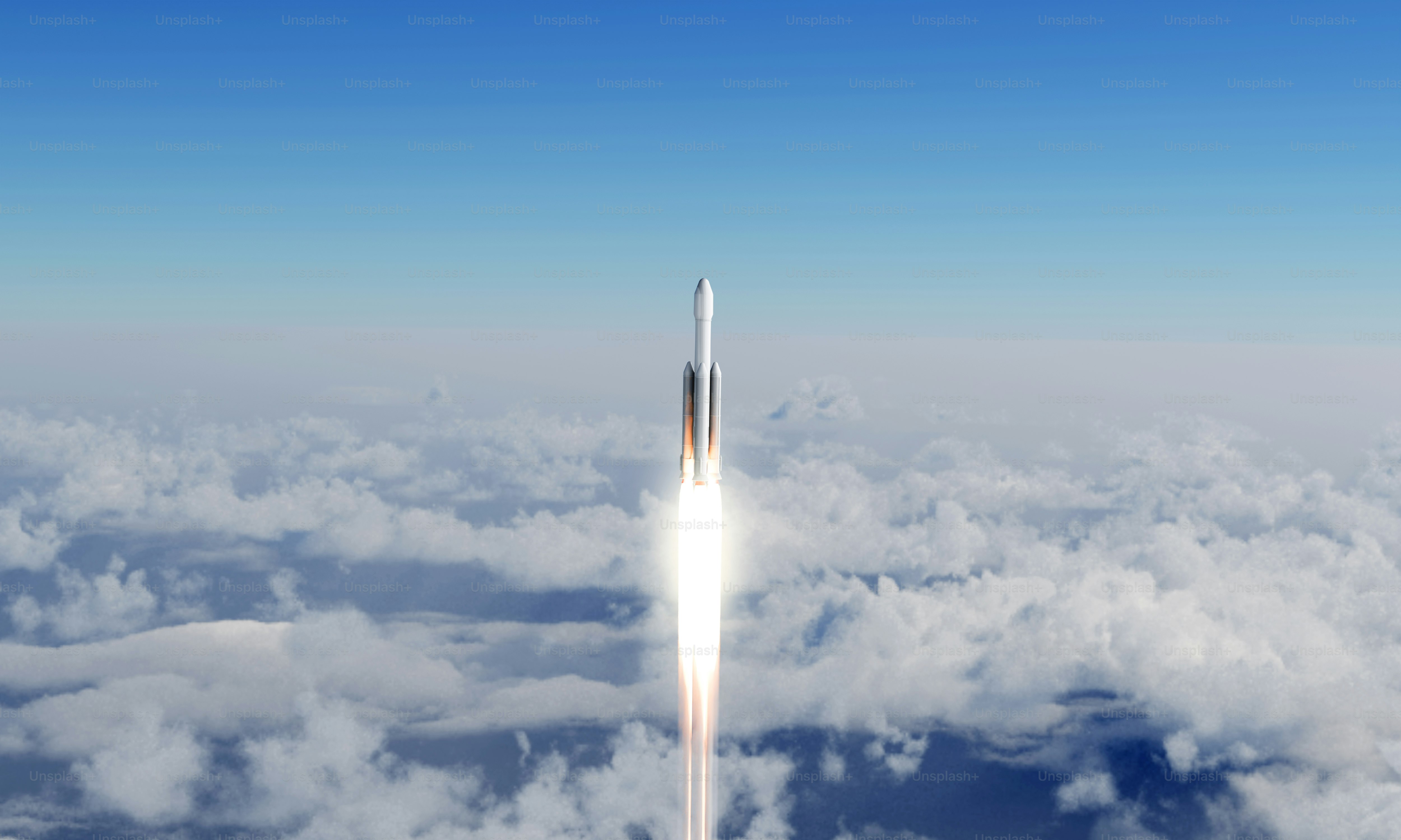 A rocket is flying high above the clouds