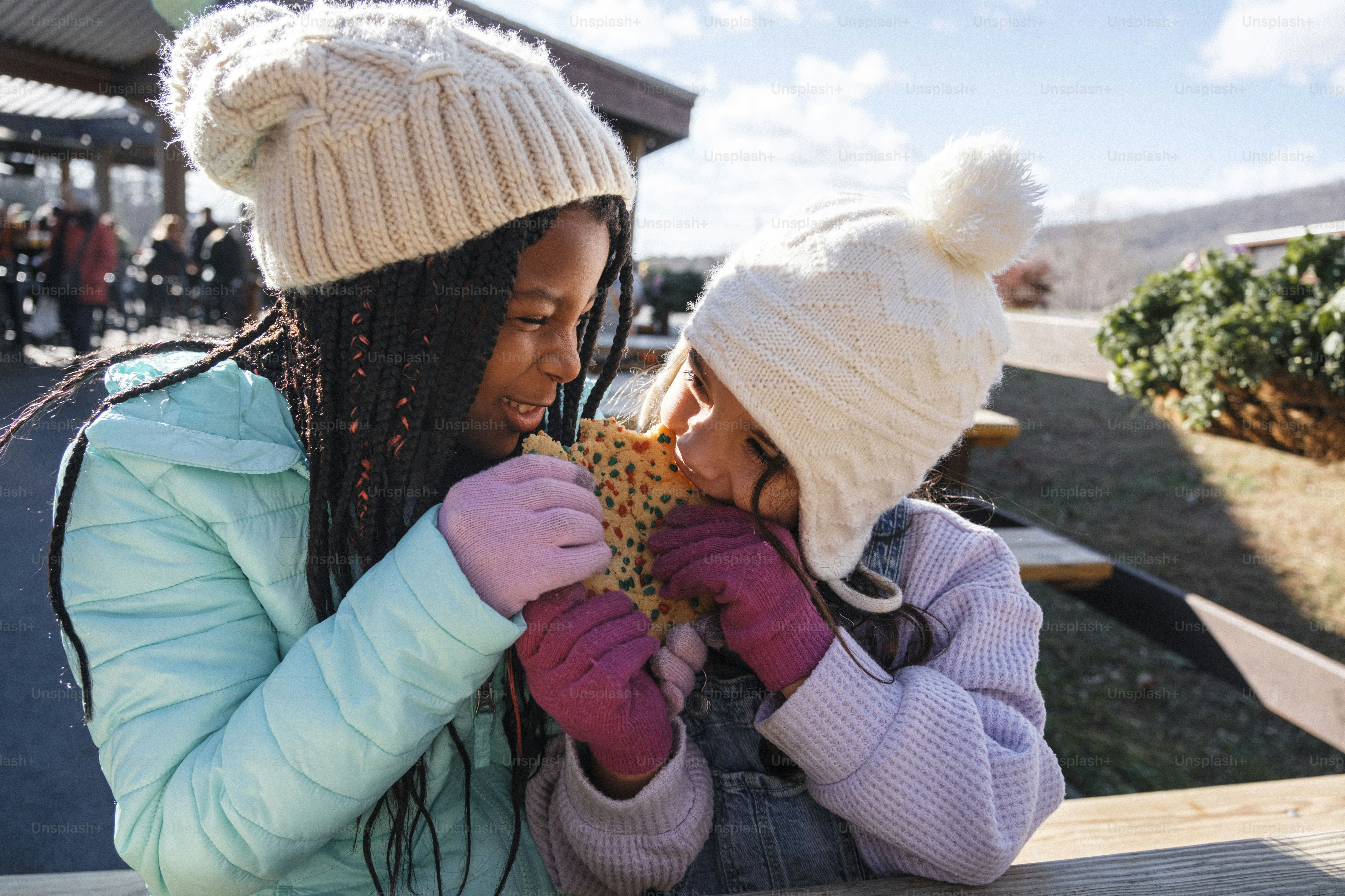 A woman and a child sitting on a bench