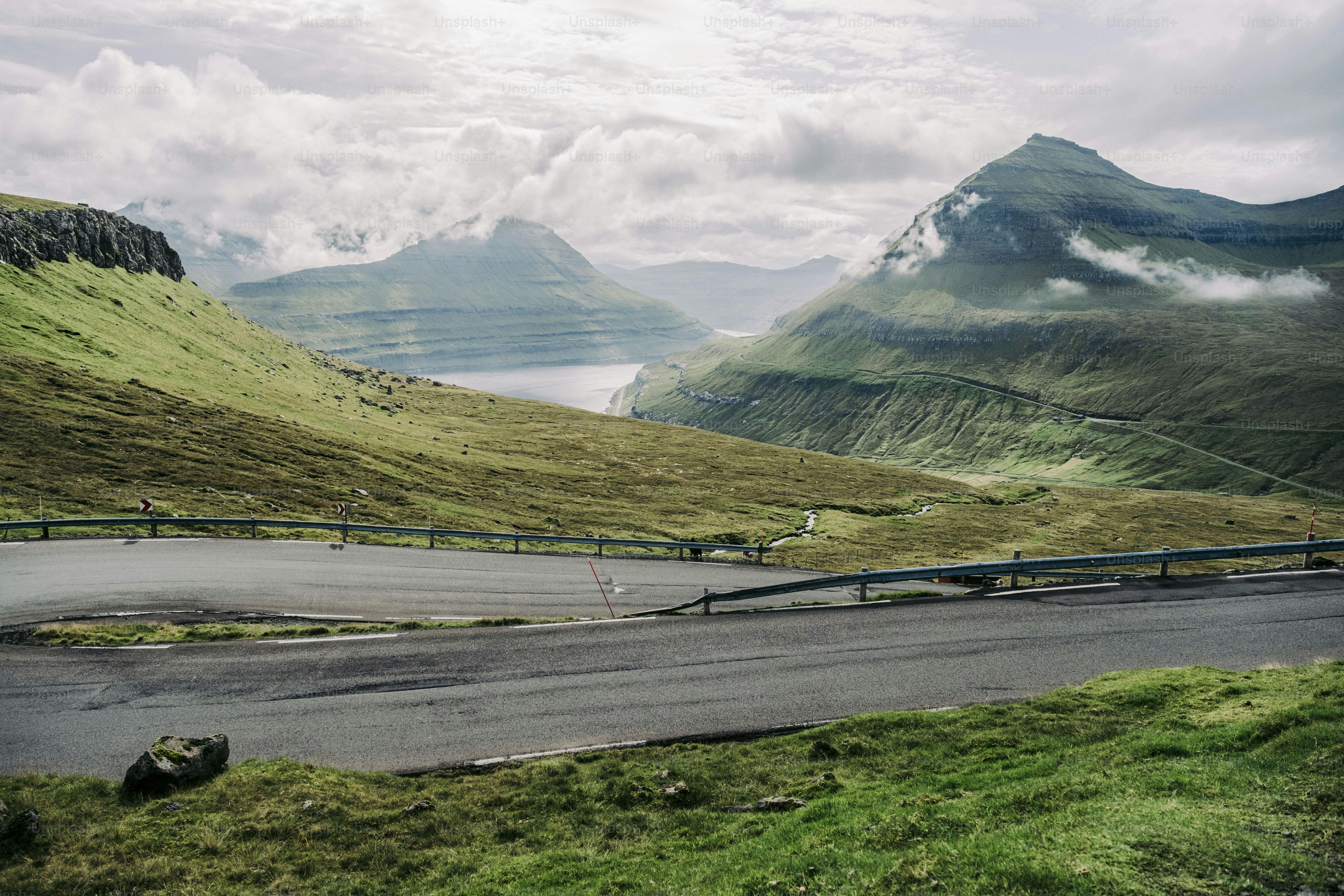 A winding road in the middle of a mountain range