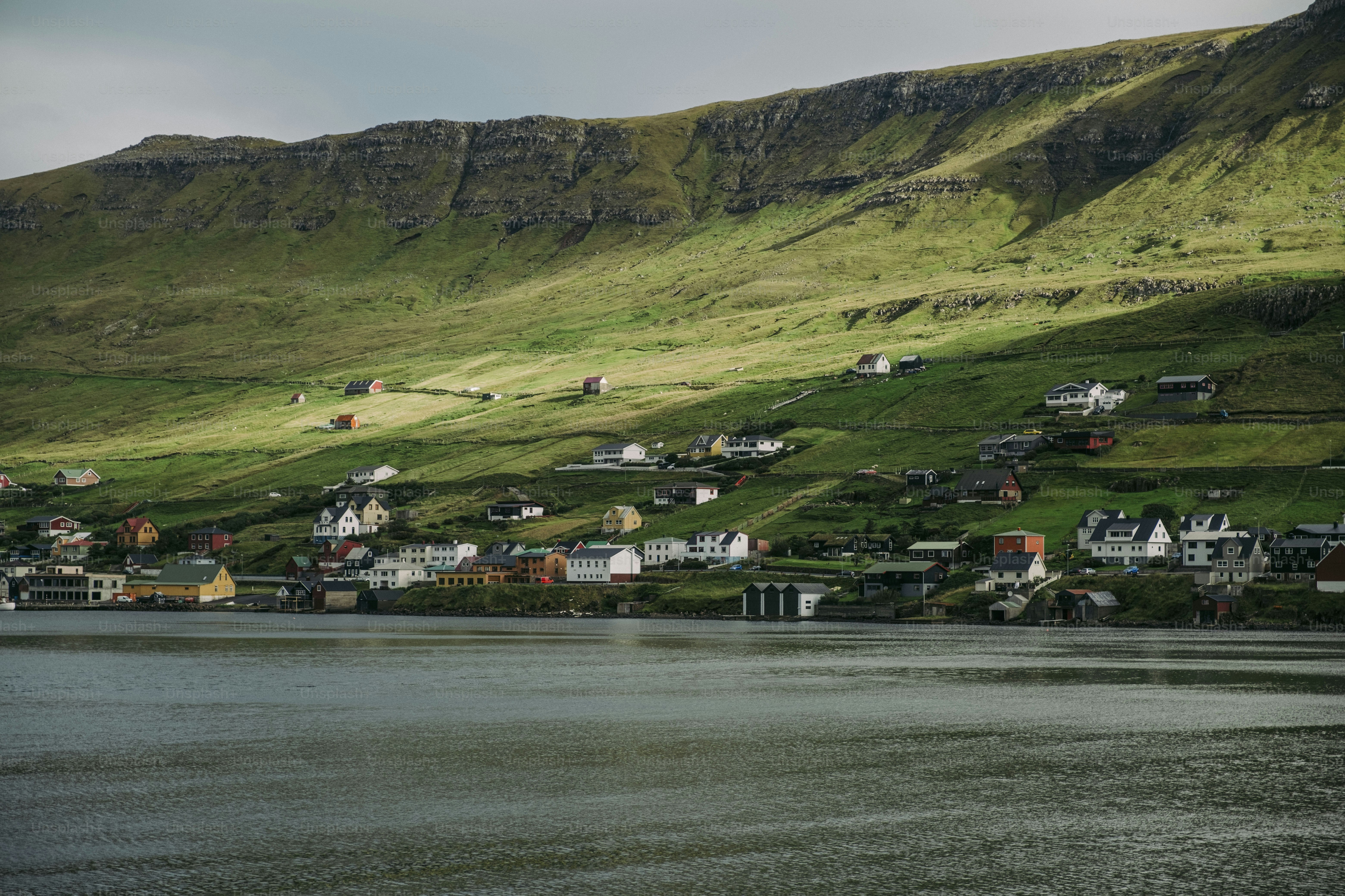 A scenic view of a small town on the side of a mountain